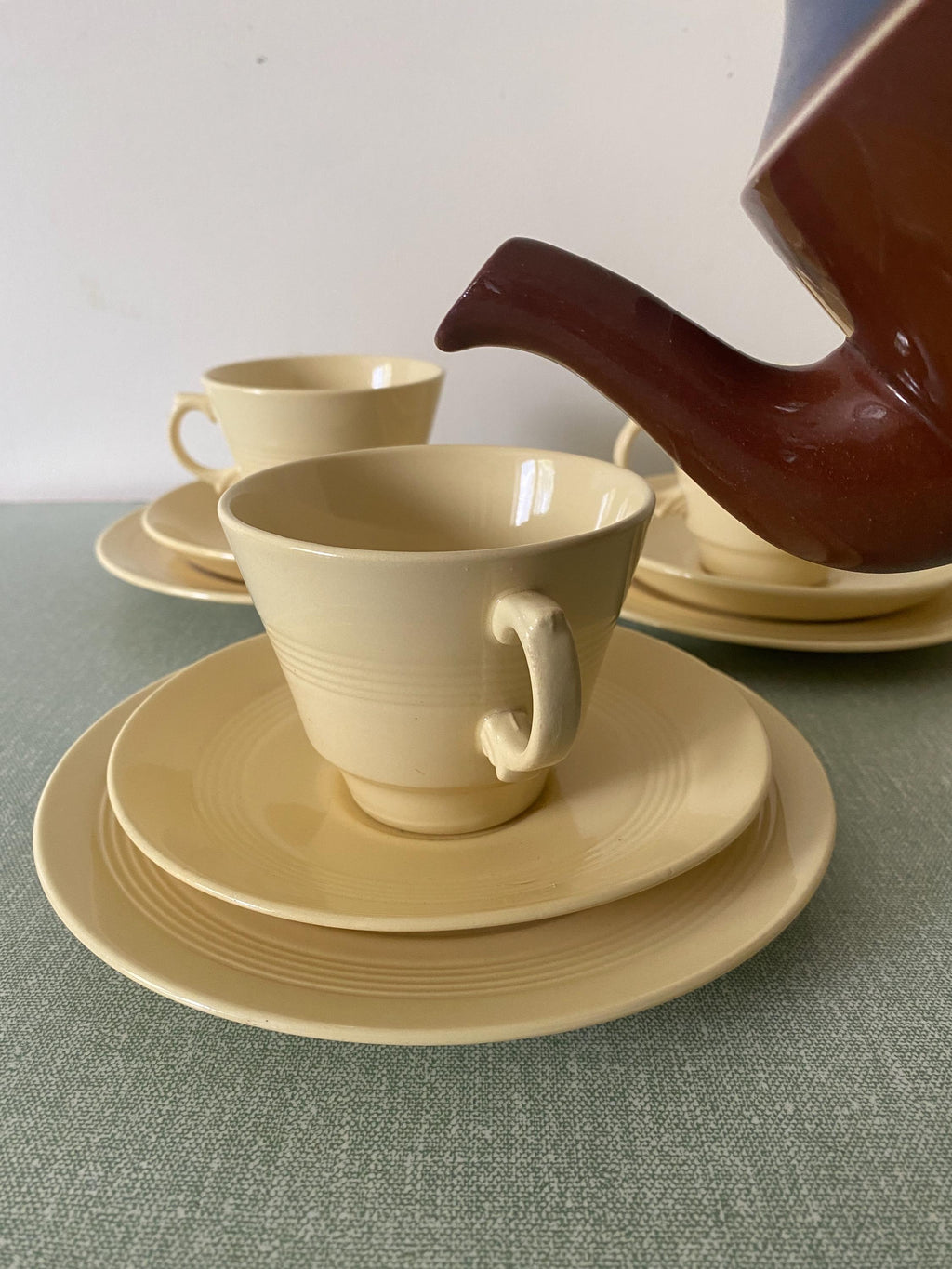 Yellow ceramic cup, saucer, and plate