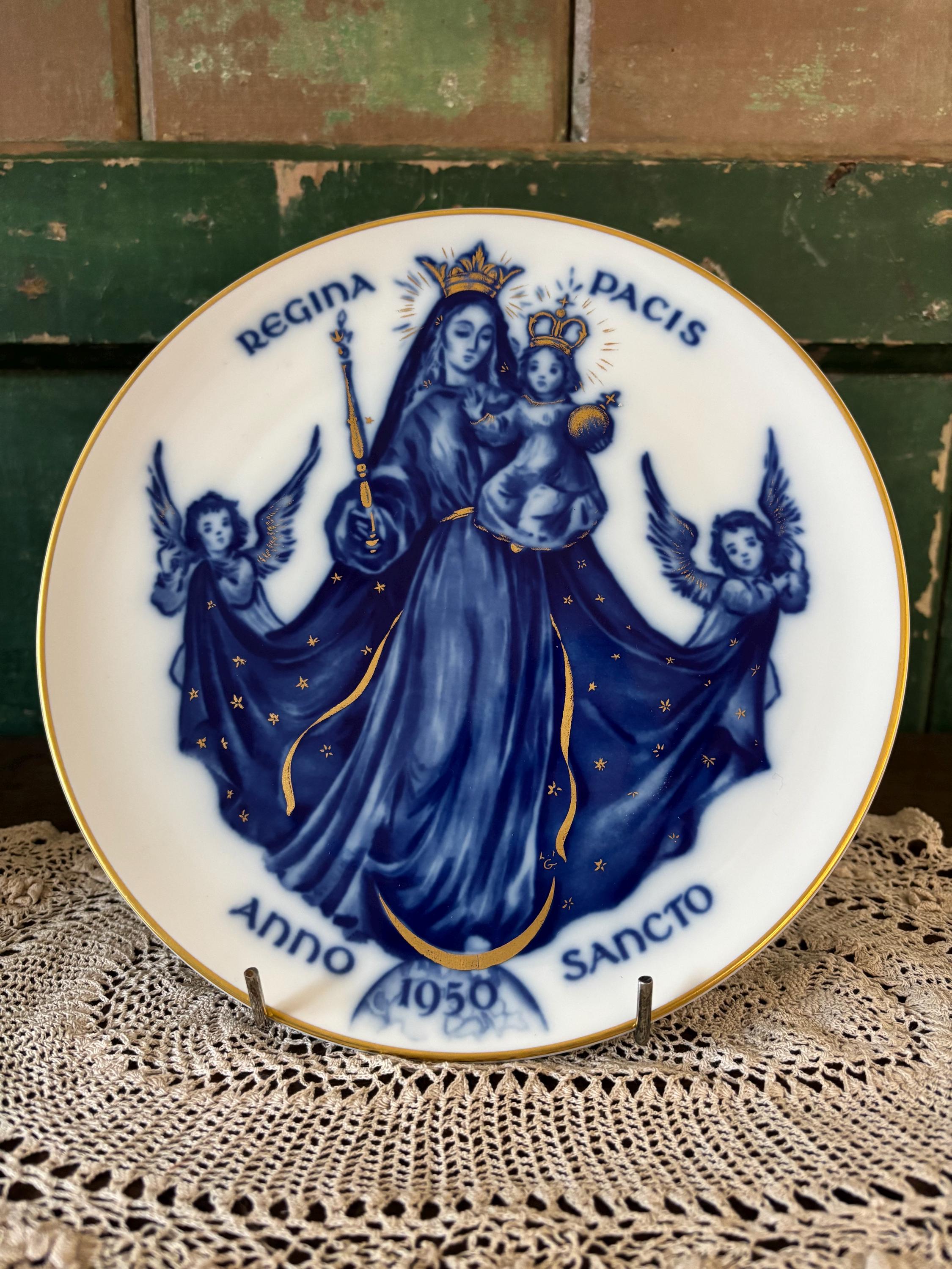 Decorative plate with blue and gold religious design featuring Mary and angels