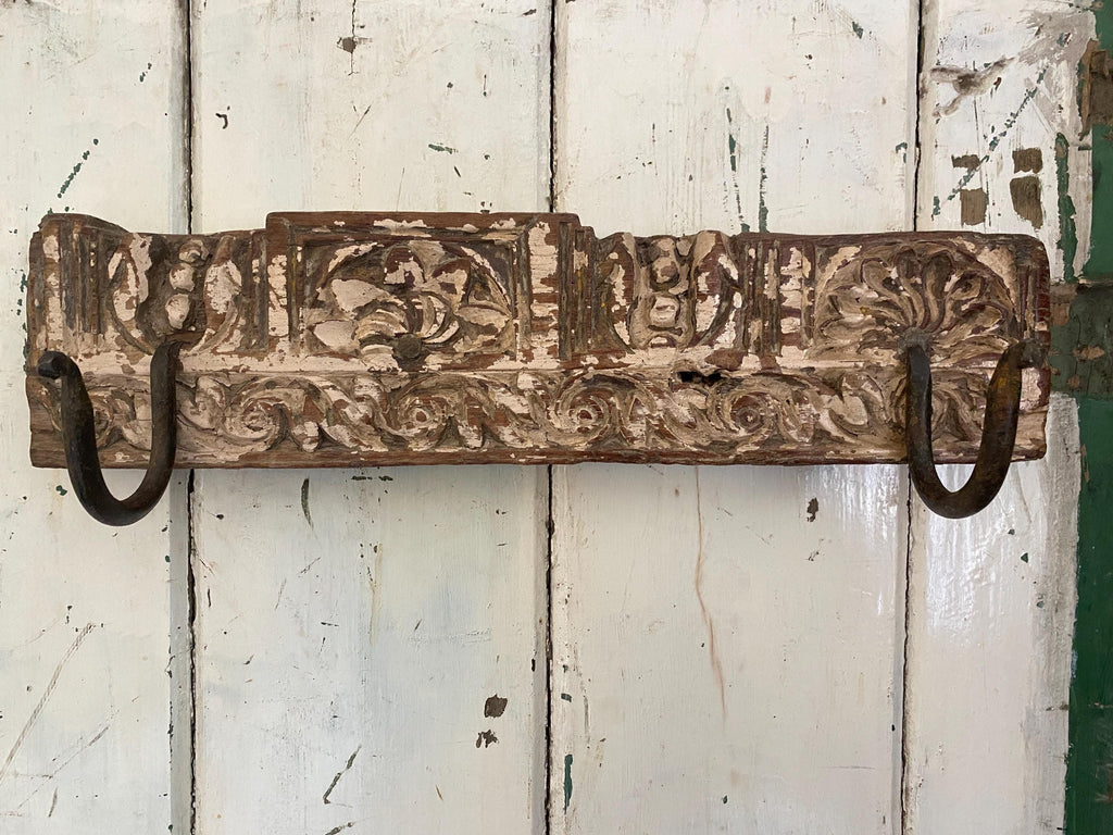Decorative wooden wall hook with intricate carvings