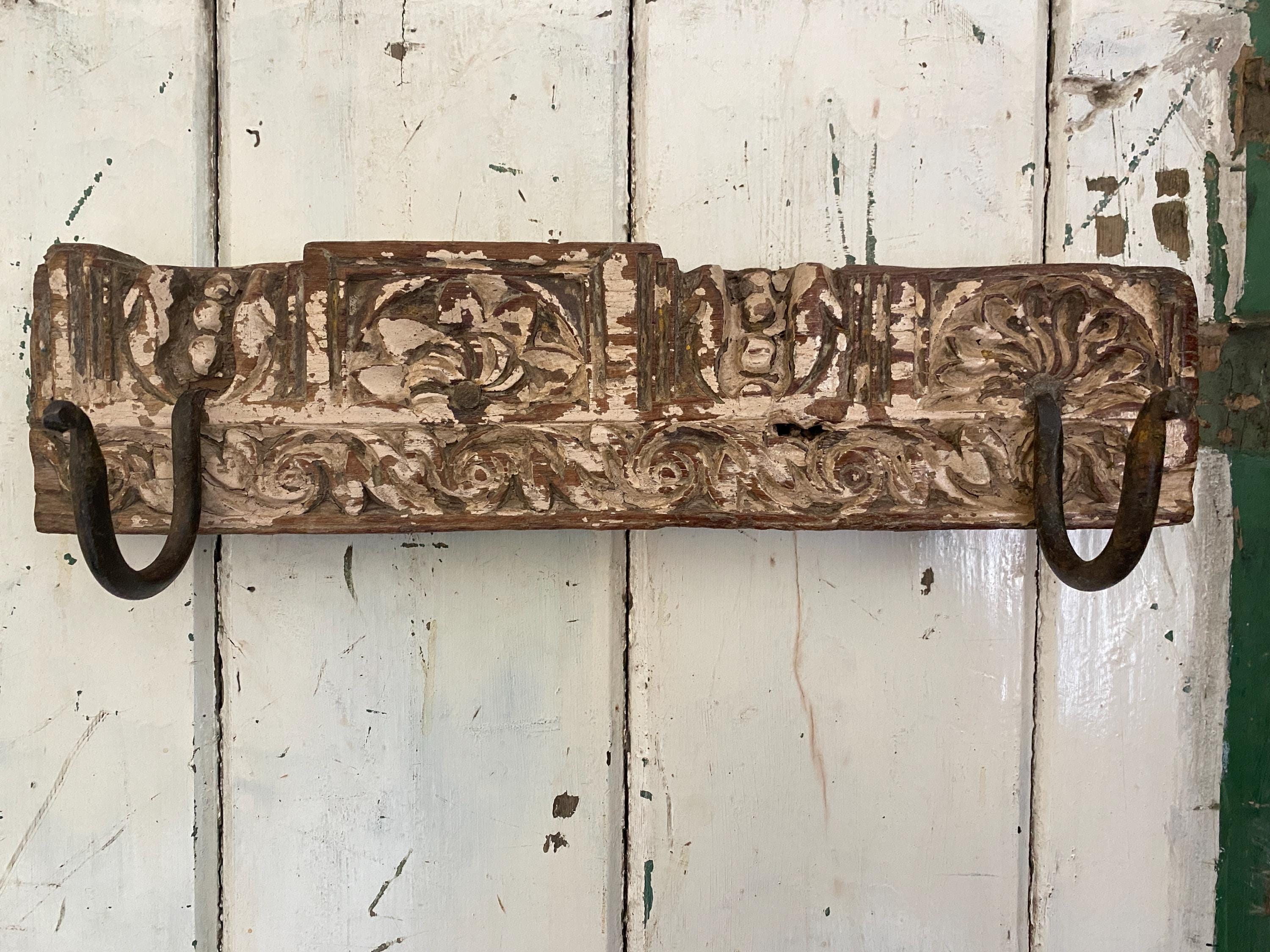 Decorative wooden wall hook with intricate carvings