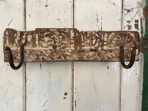 Decorative wooden wall hook with intricate carvings