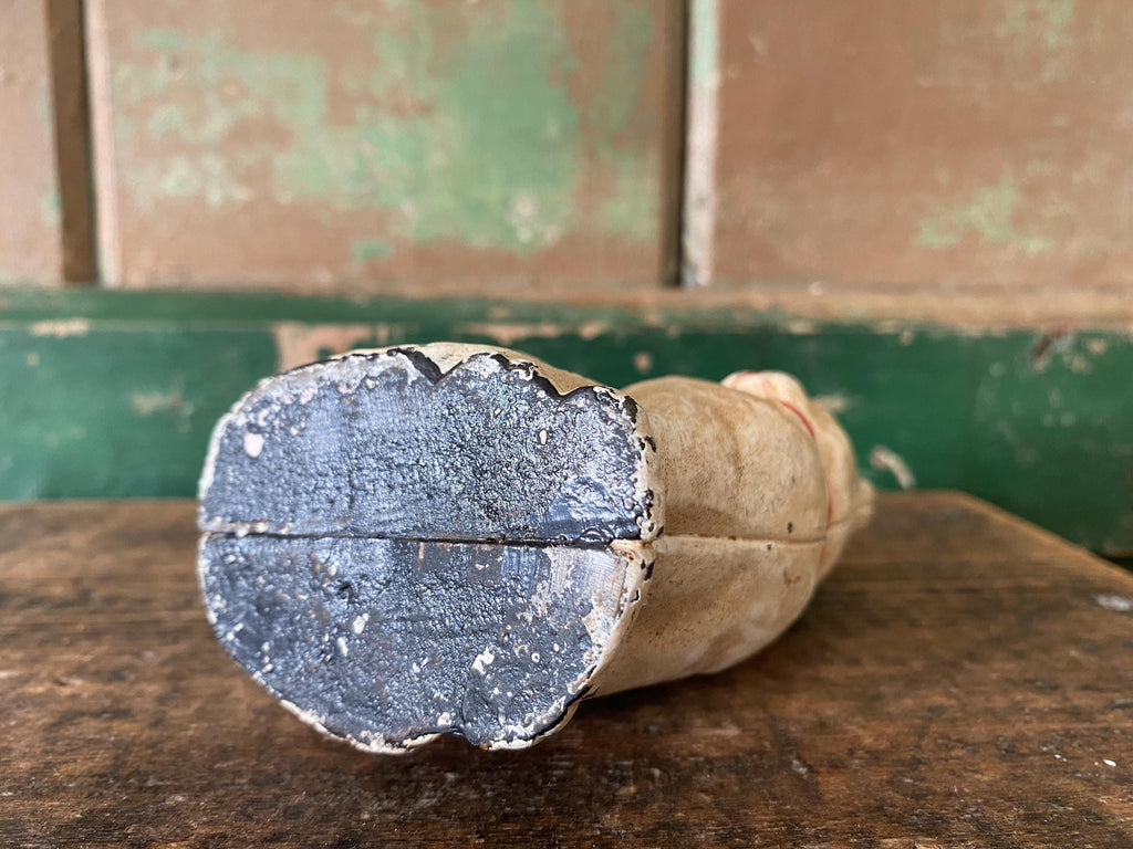 Base of a cast metal figurine