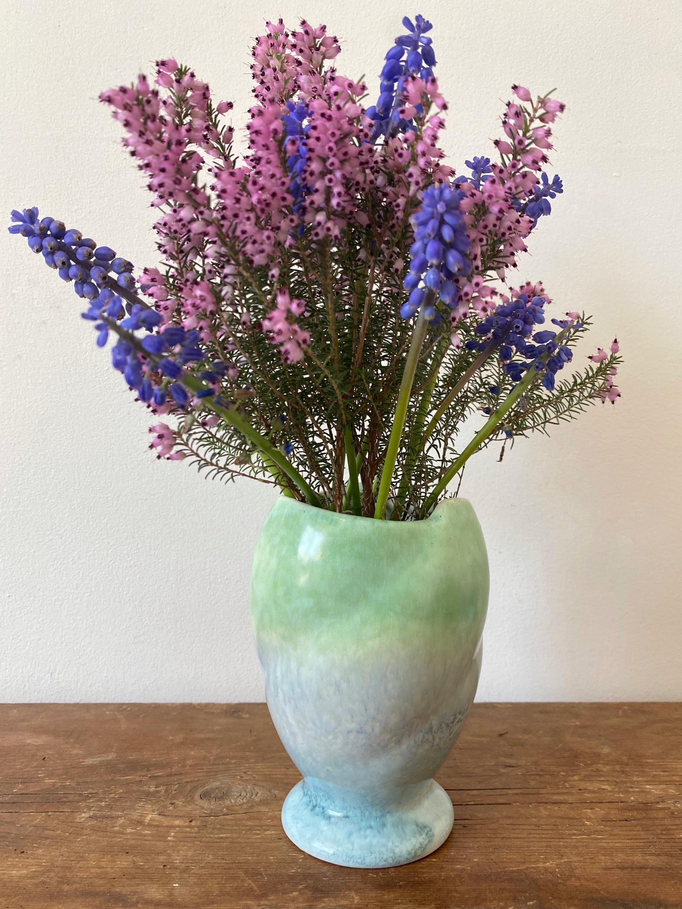 A blue and green ceramic vase 