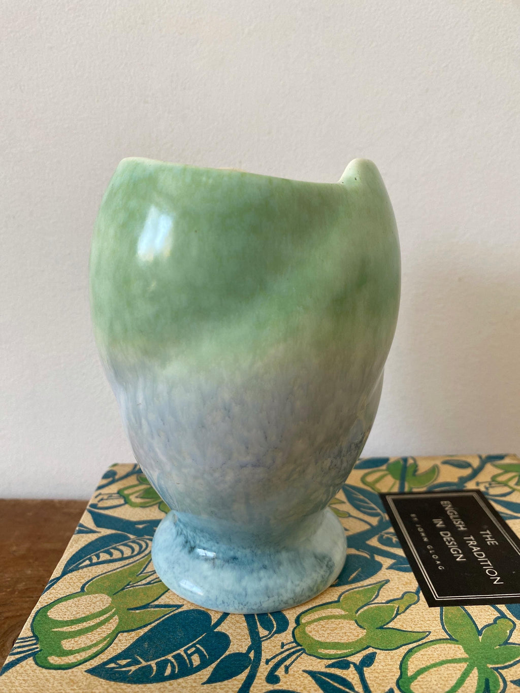 A blue and green ceramic vase