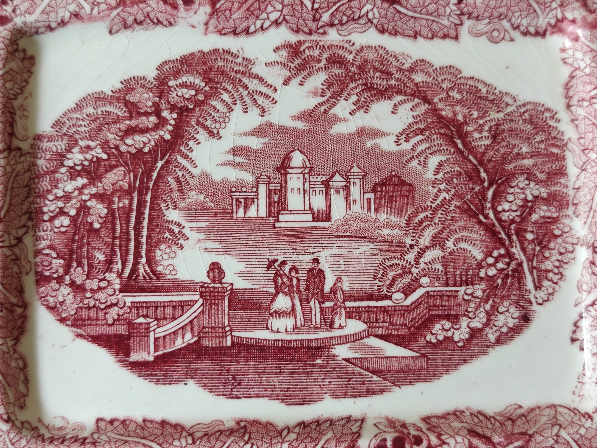 The base of a Masons Vista butter dish showing the traditional landscape transfer print.