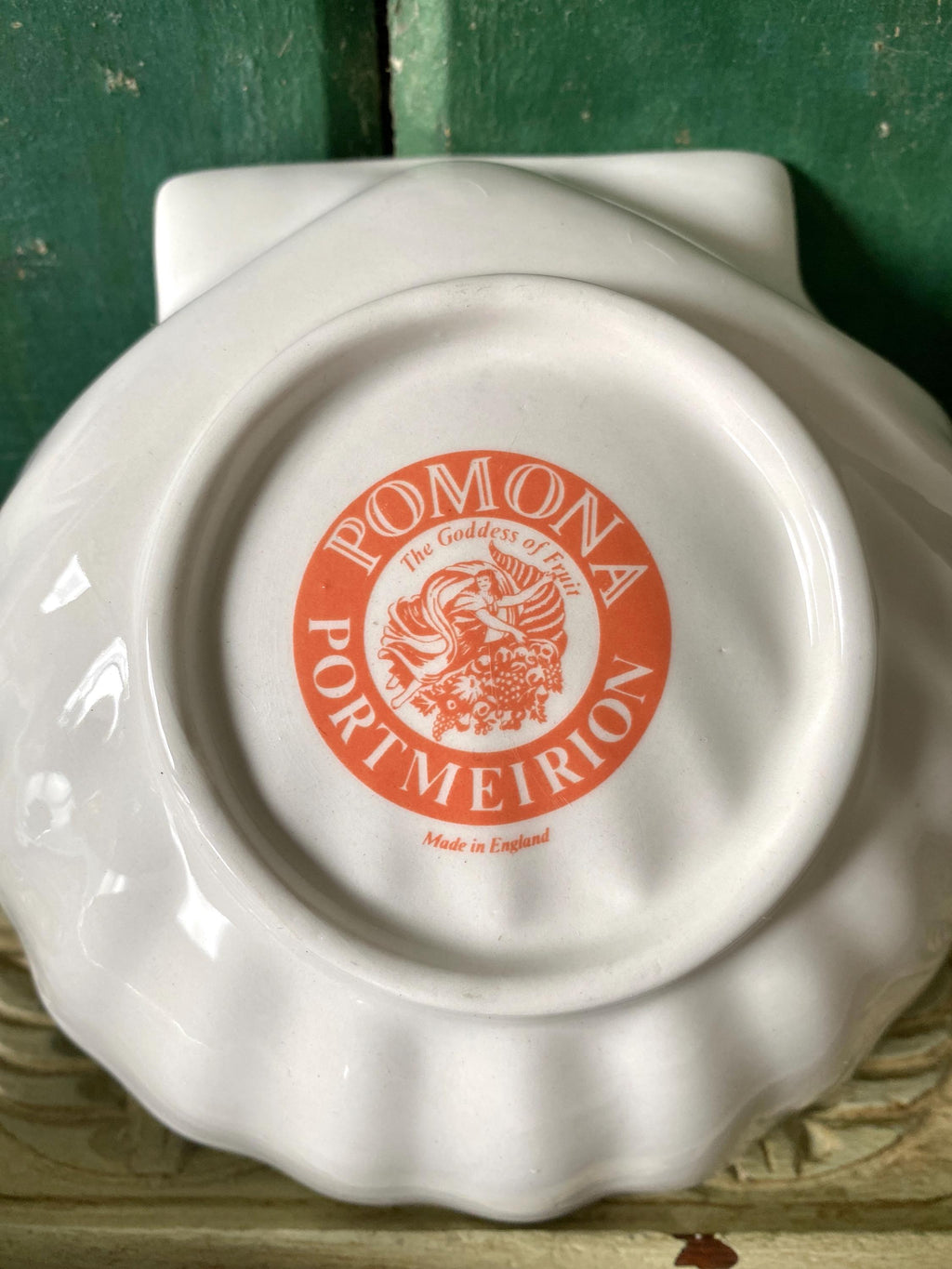 White ceramic dish with 'Pomona Portmeirion' logo