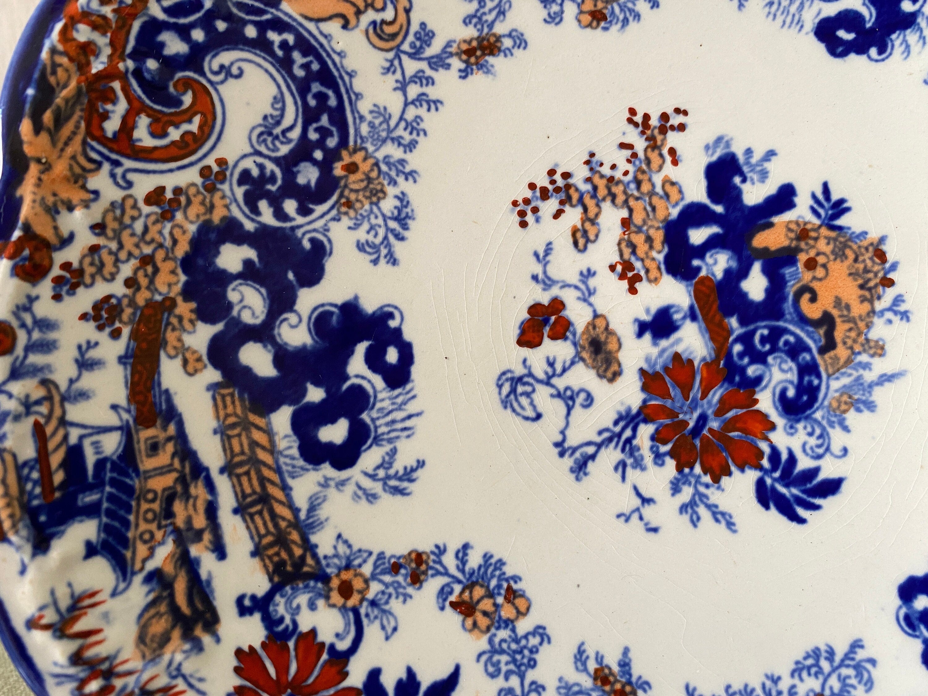 Detail of blue and red floral decoration on a plate