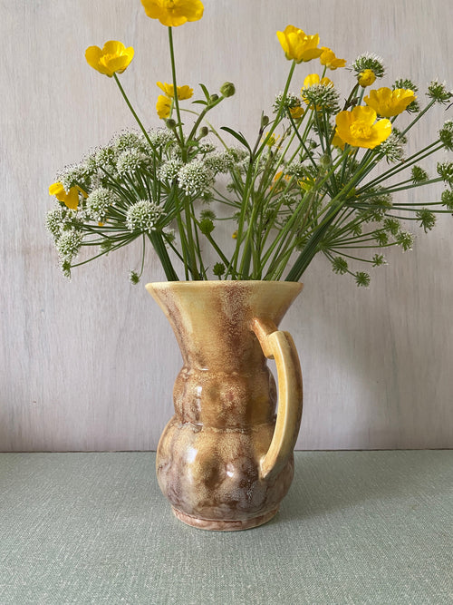 Brown ceramic jug with mottled glaze