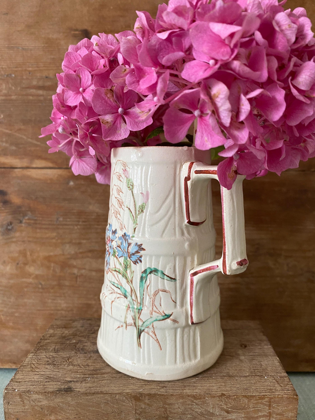 Antique jug with floral decoation