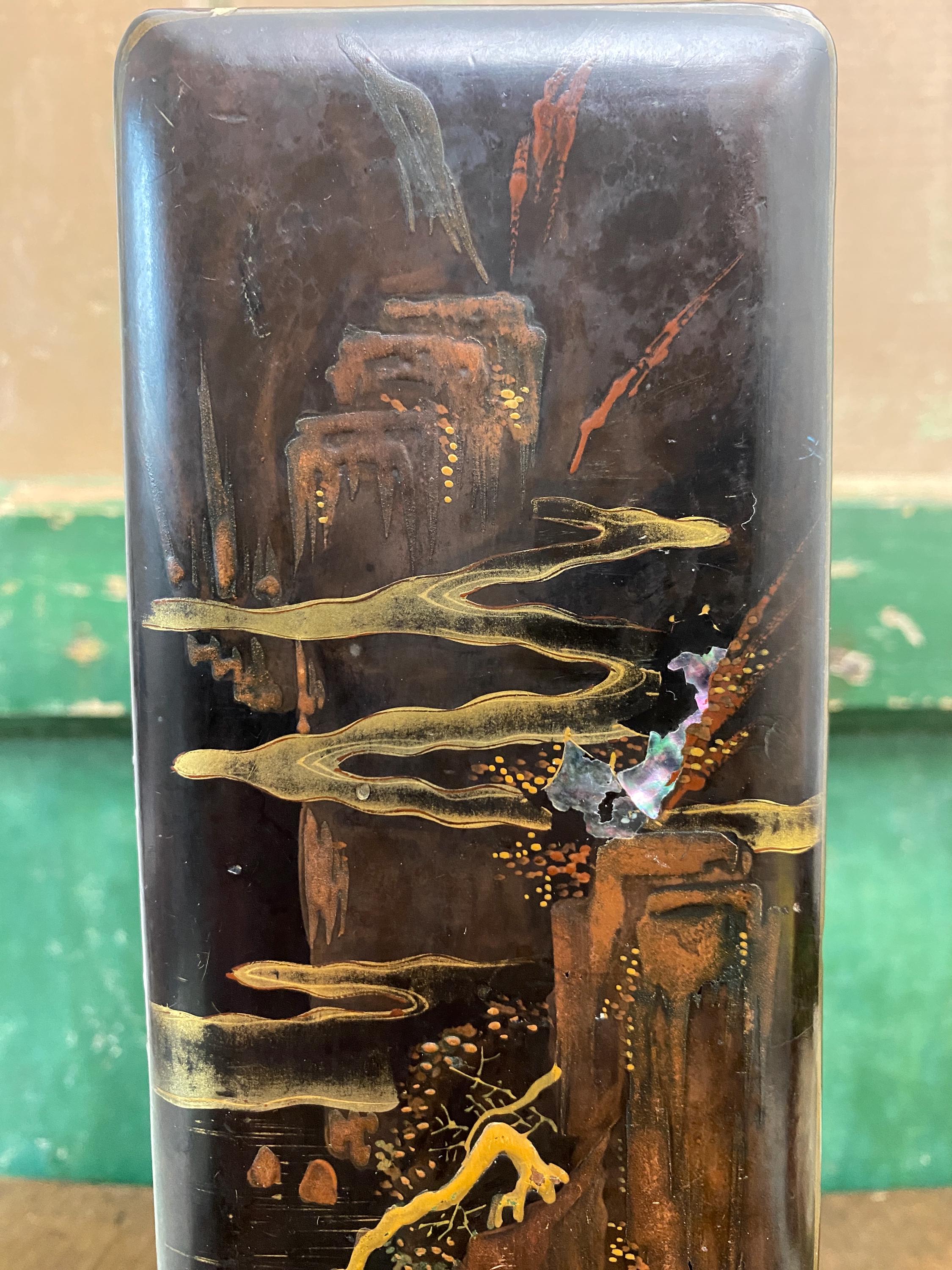 Close up of decorative wooden box with oriental style landscape picture