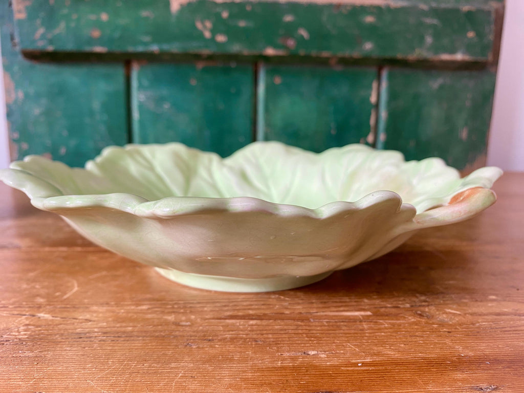 Side view of a decorative ceramic leaf-shaped dish