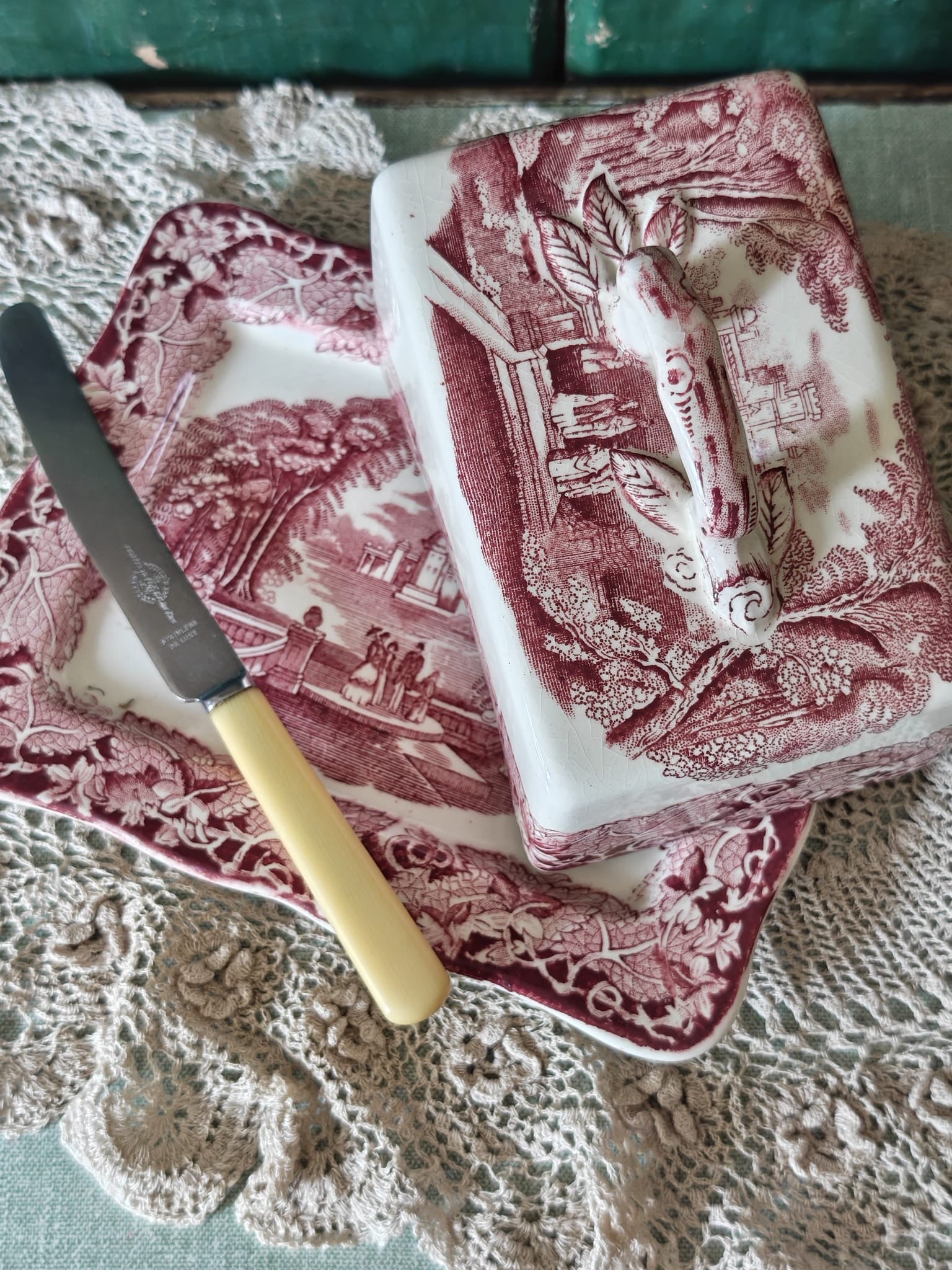 A Masons Vista butter dish set in pink with a rectangular plate and matching lid.