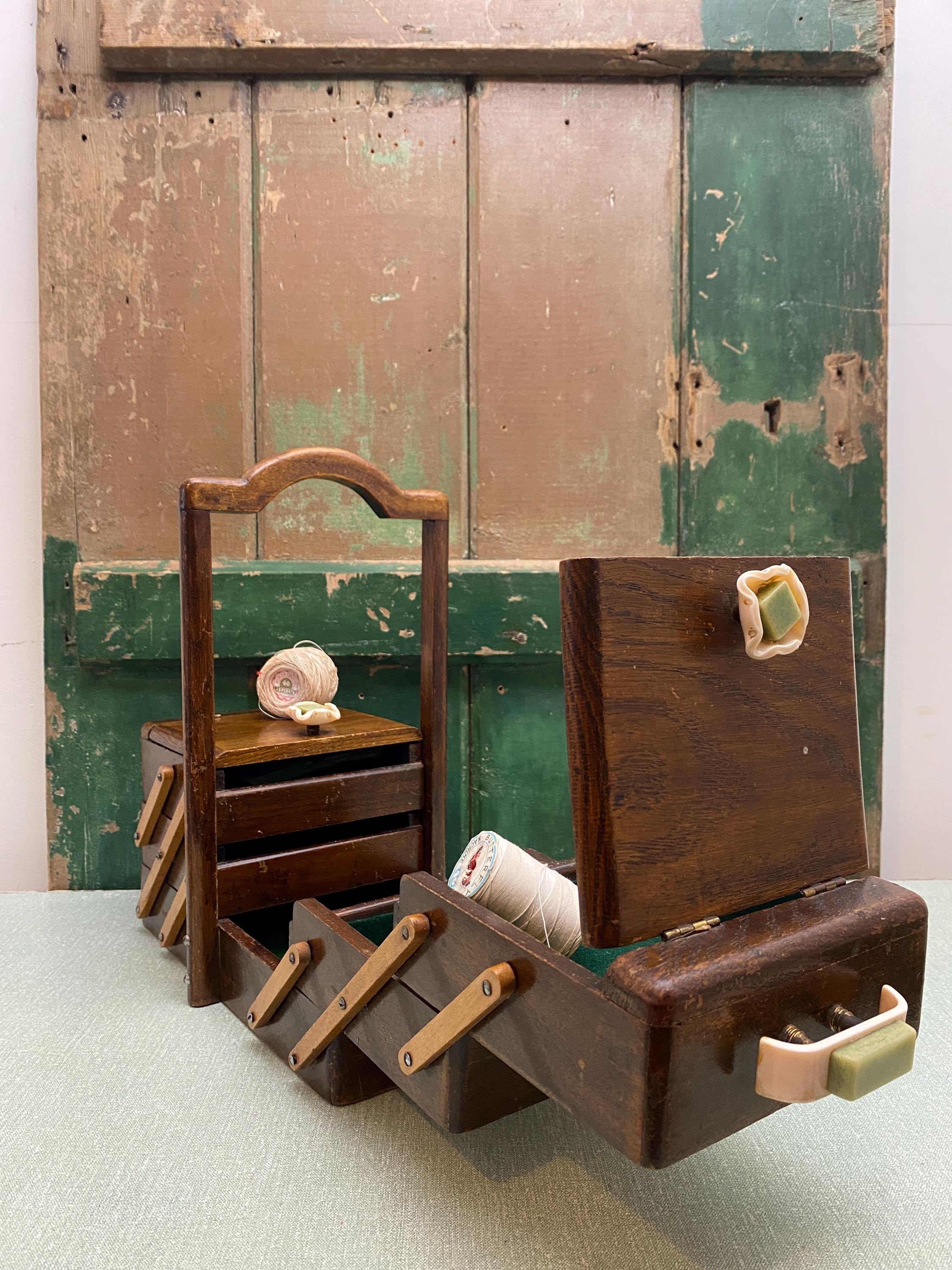 Wooden sewing box with compartments and a wooden handle