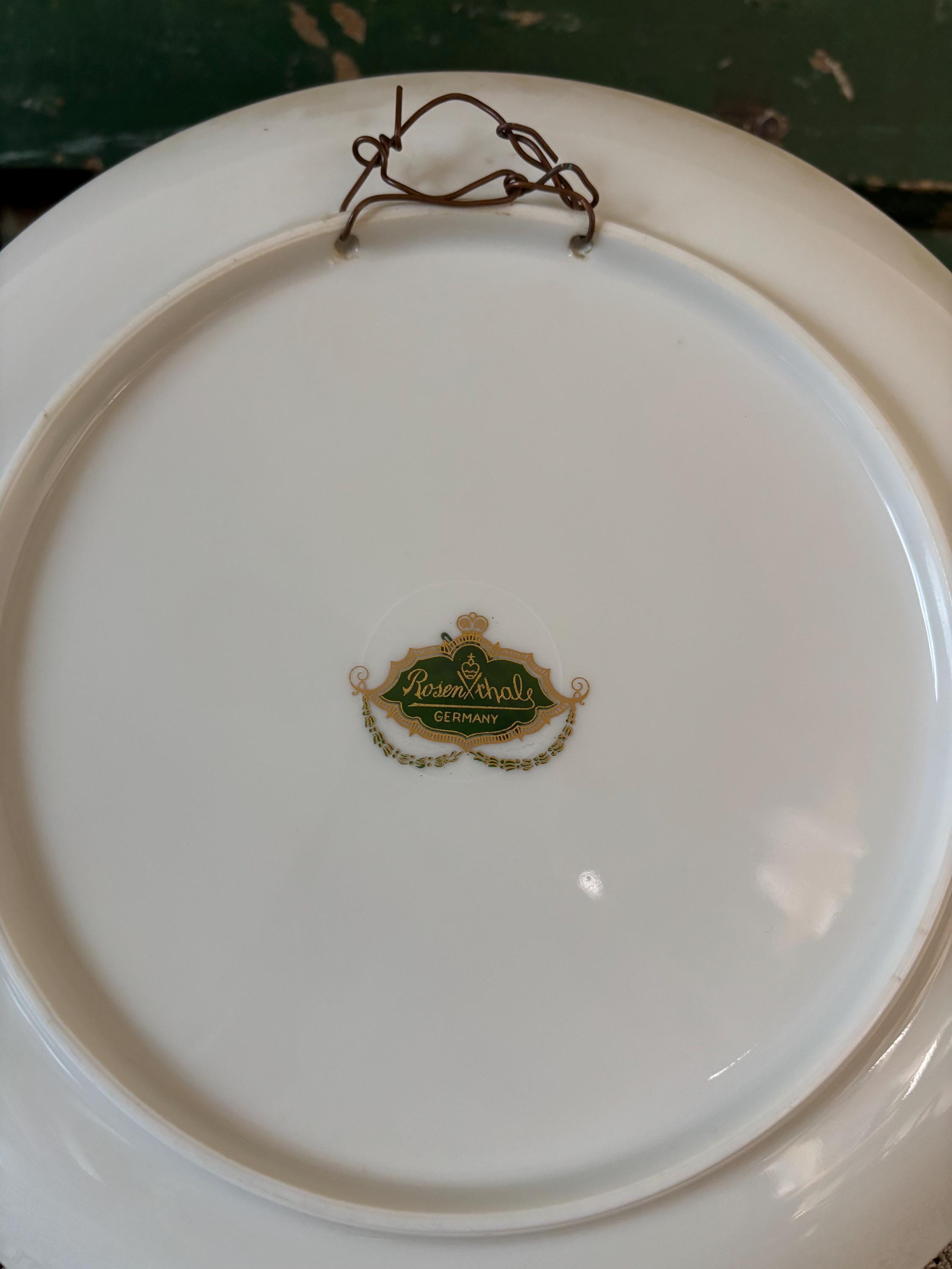 Back view of a white plate with 'Rosenthal Germany' on a green and gold label