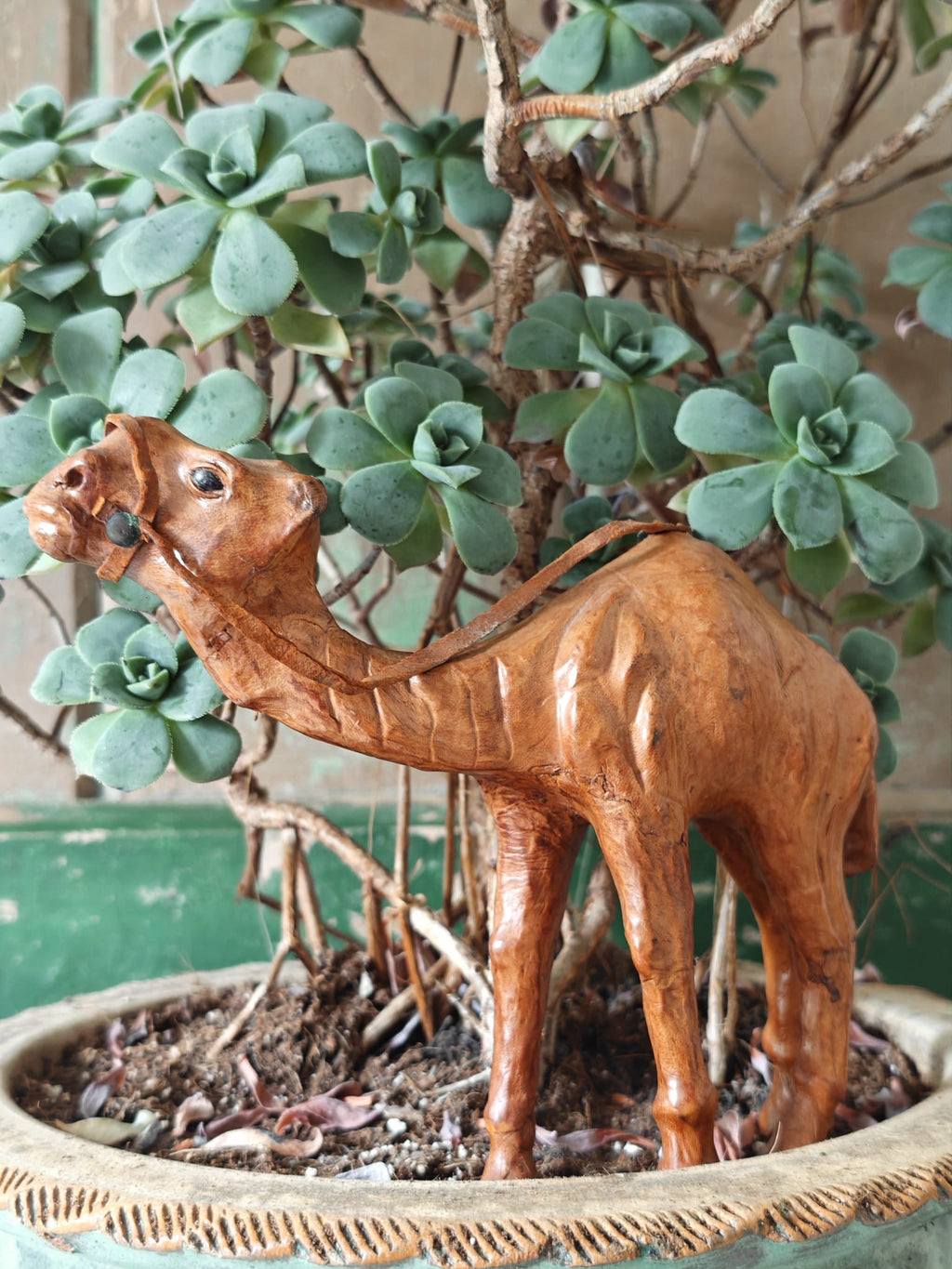 A brown leather covered camel figurine
