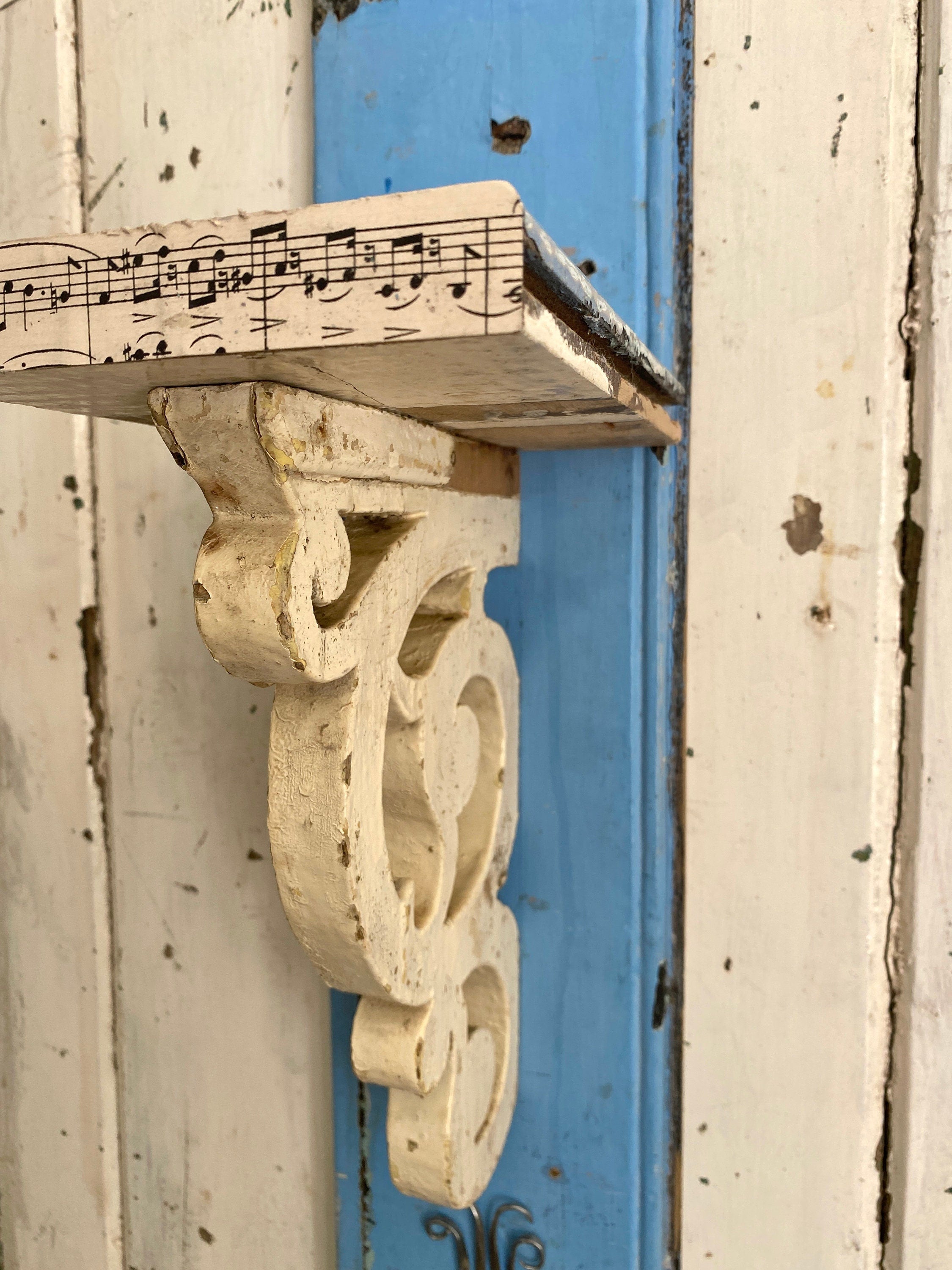 Rustic wooden shelf with decorative corbel