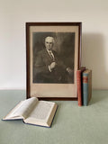 Framed portrait of a man in a brown wooden frame