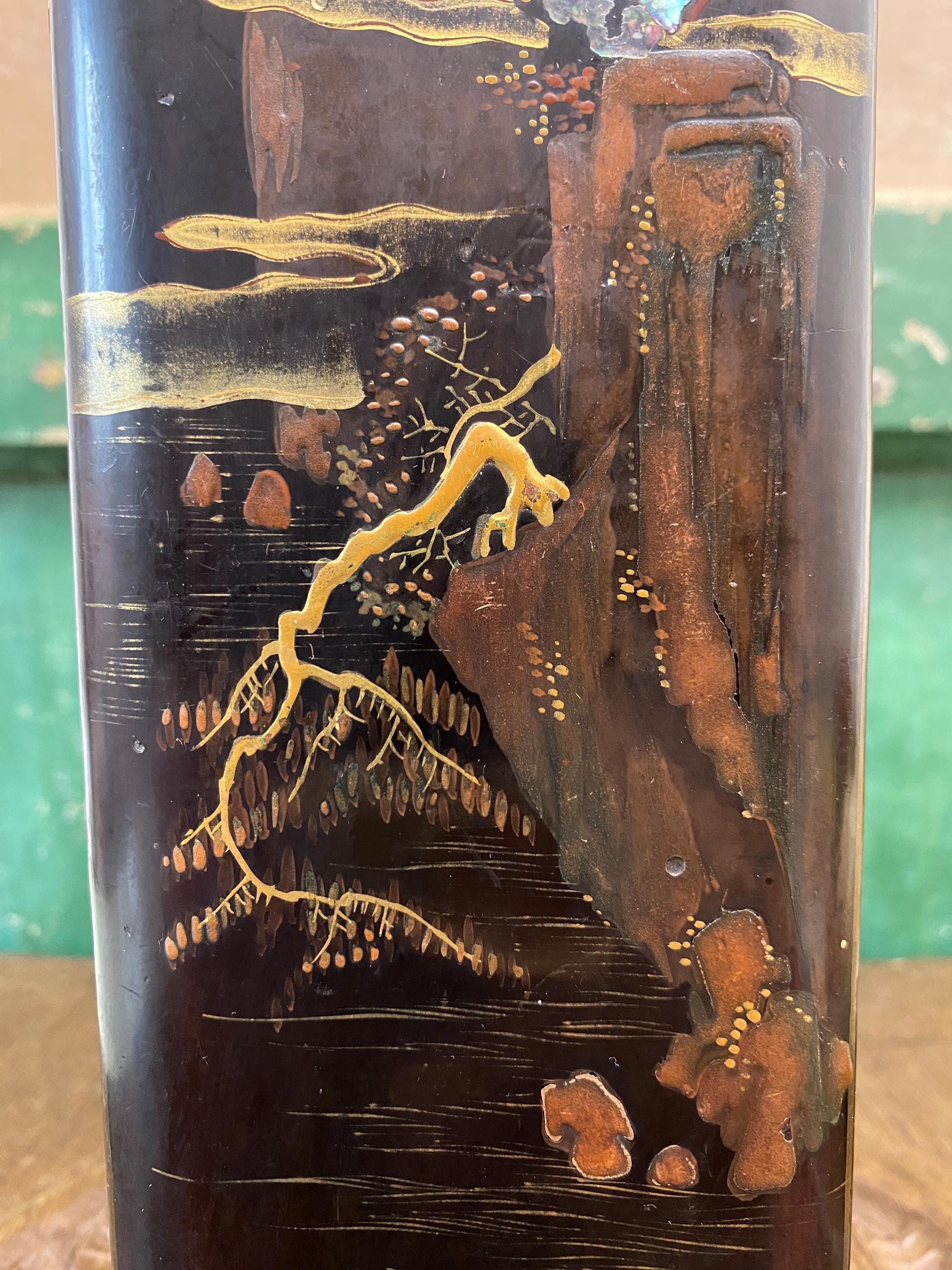 Close-up of a decorative wooden box with Japanese style landscape picture