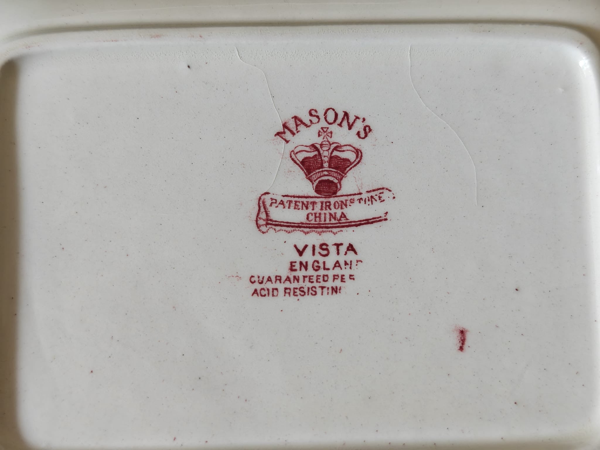 The bottom of a white ceramic plate or dish with a red printed Mason's Vista England logo and text.