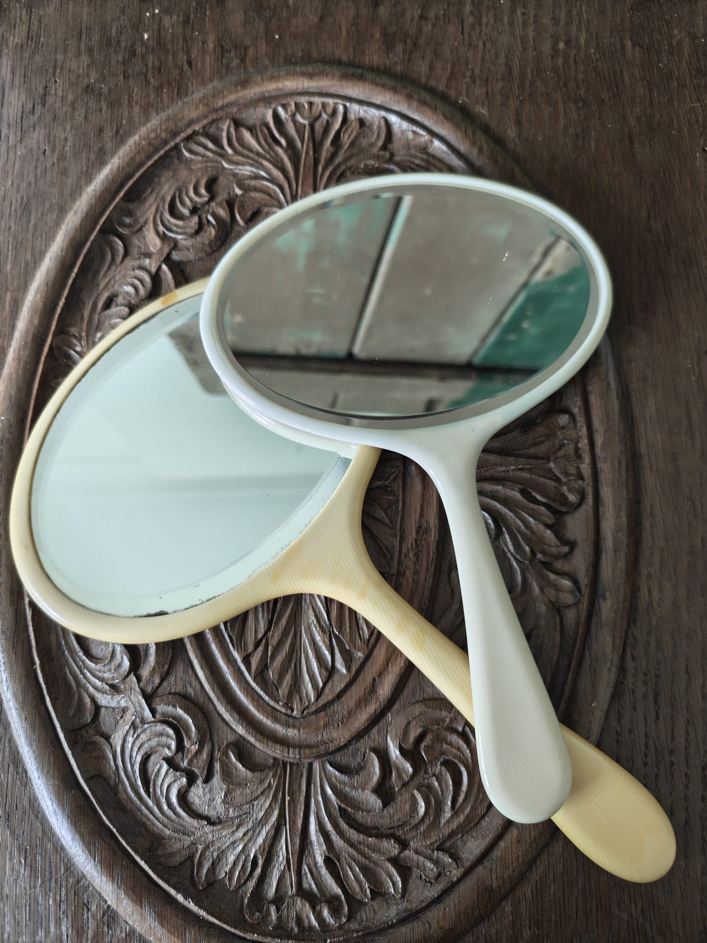 two vintage hand mirrors