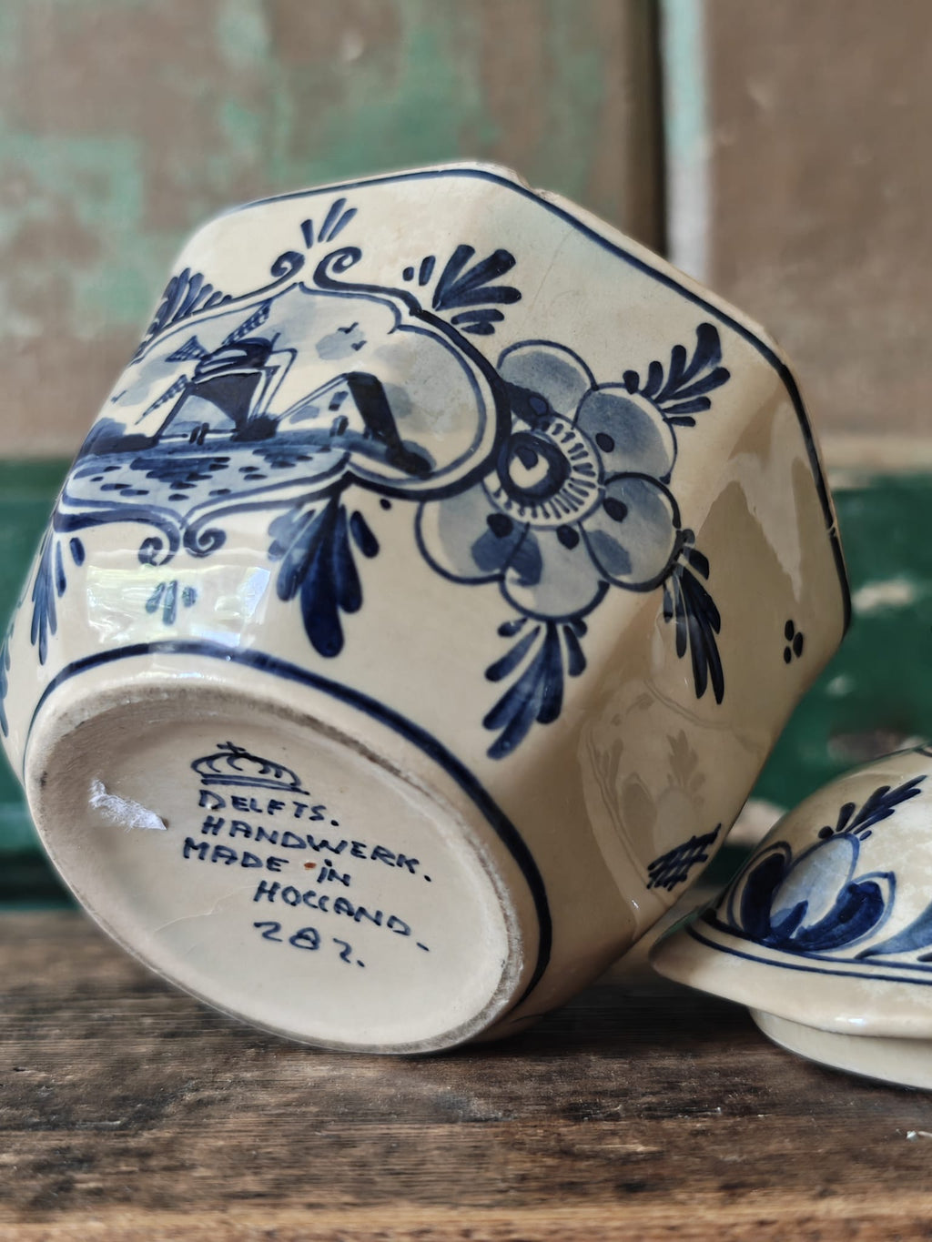 Blue and white hand painted stoneware sugar bowl with lid, showing makers mark underneath