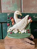 Cast iron door stop with white ducks and chicks