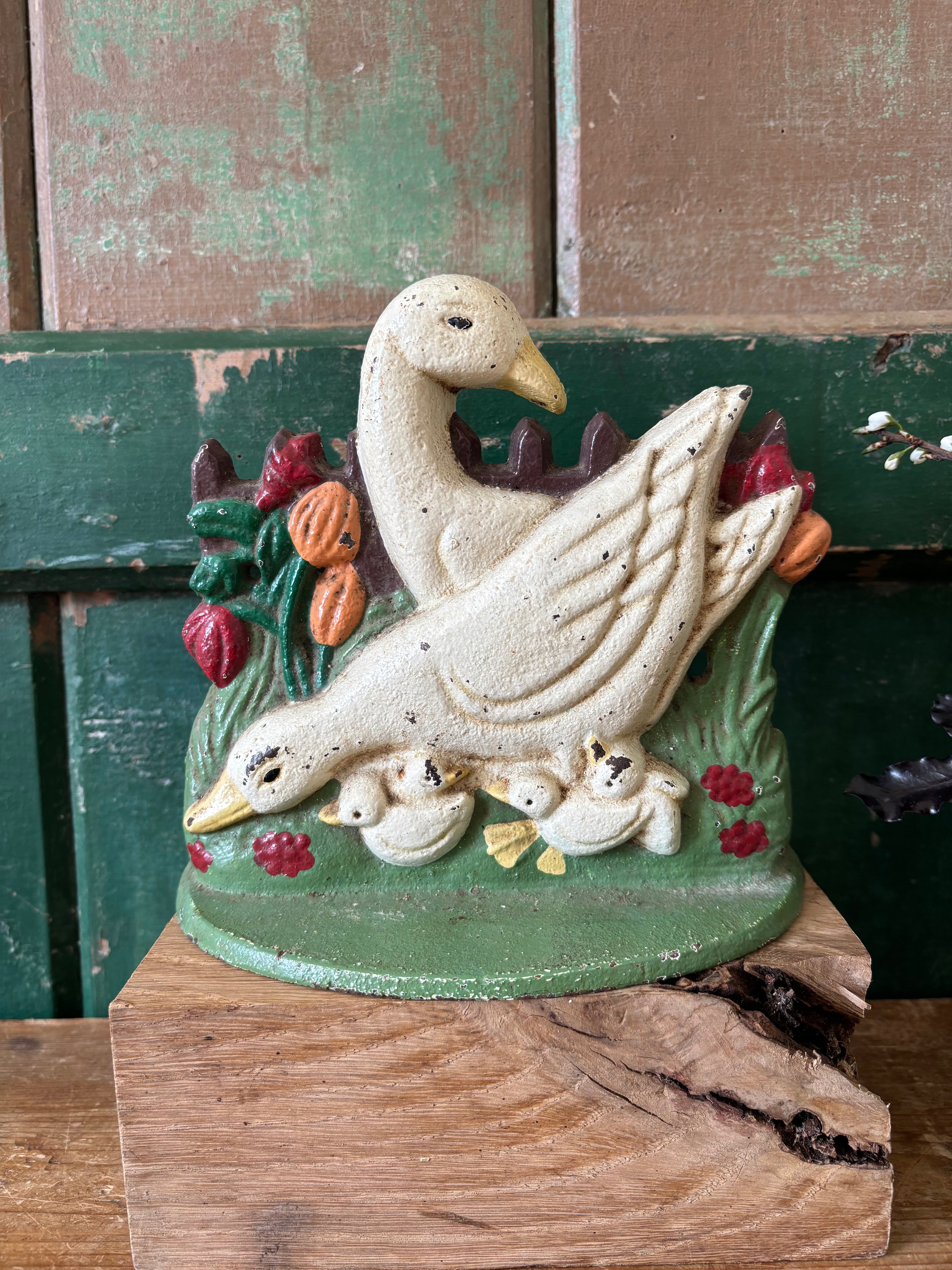Cast iron door stop with white ducks and chicks