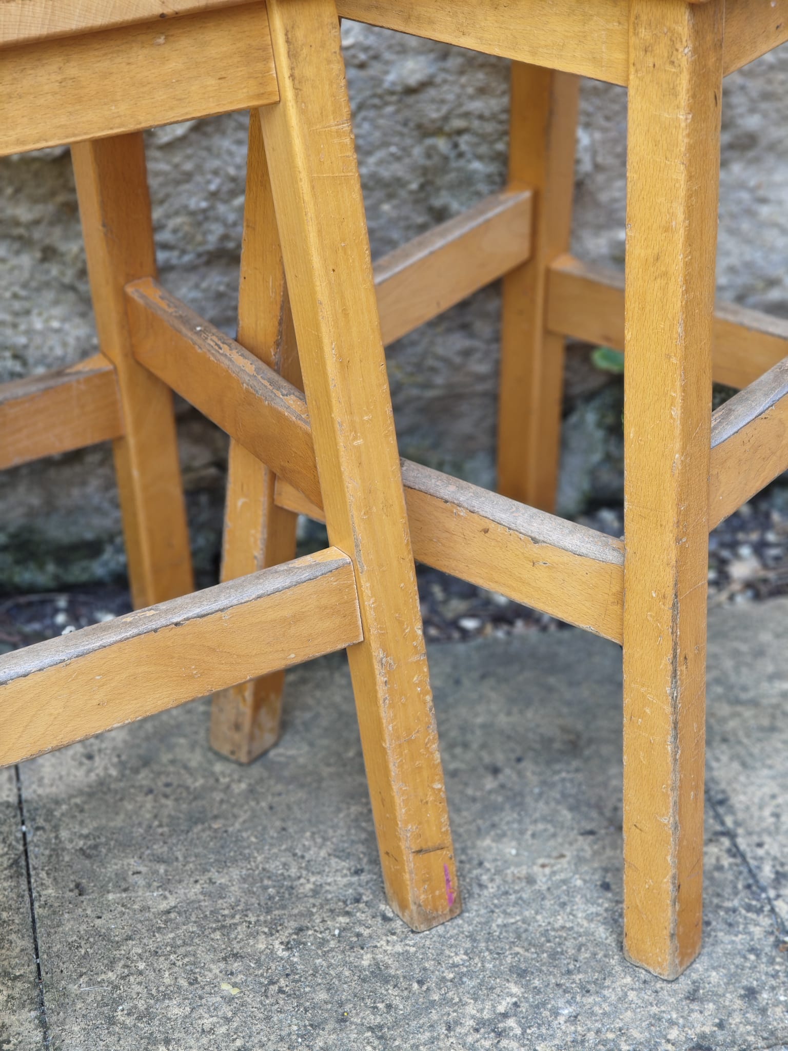 Close-up of a light natural wood stool legs