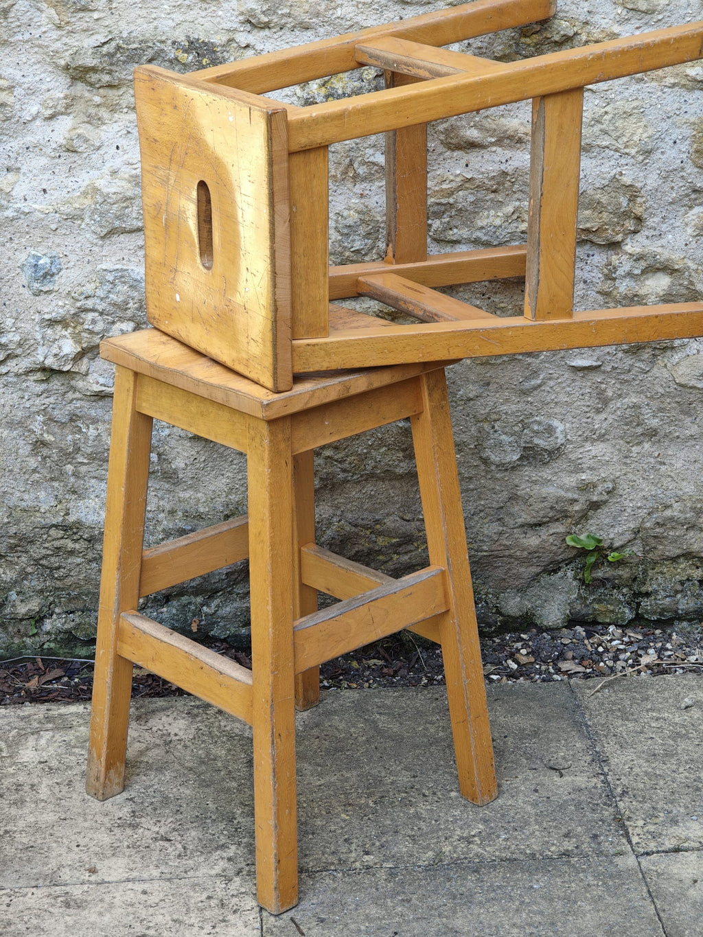 Two light natural wood stools