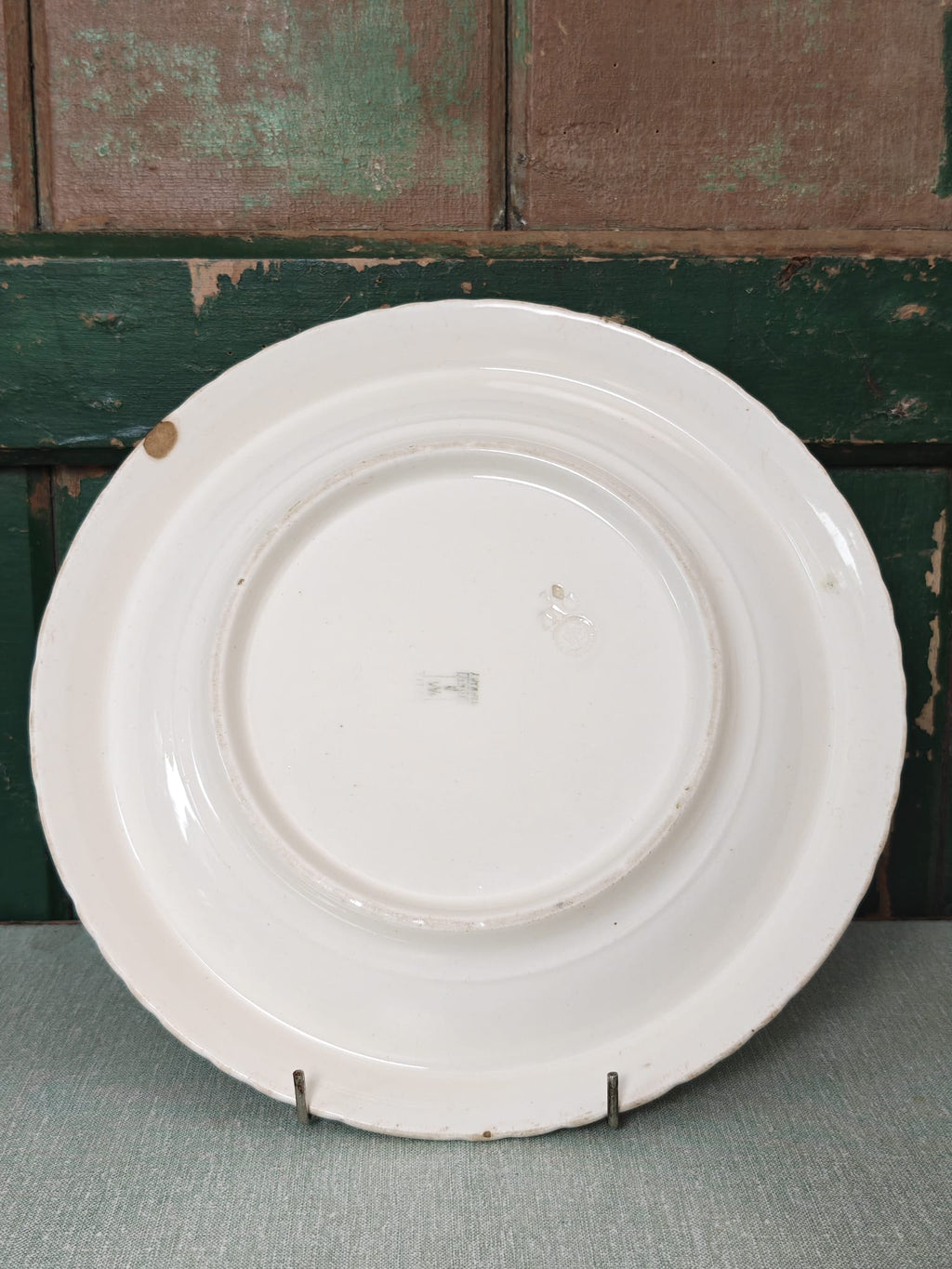 A white ceramic plate shown from the back.