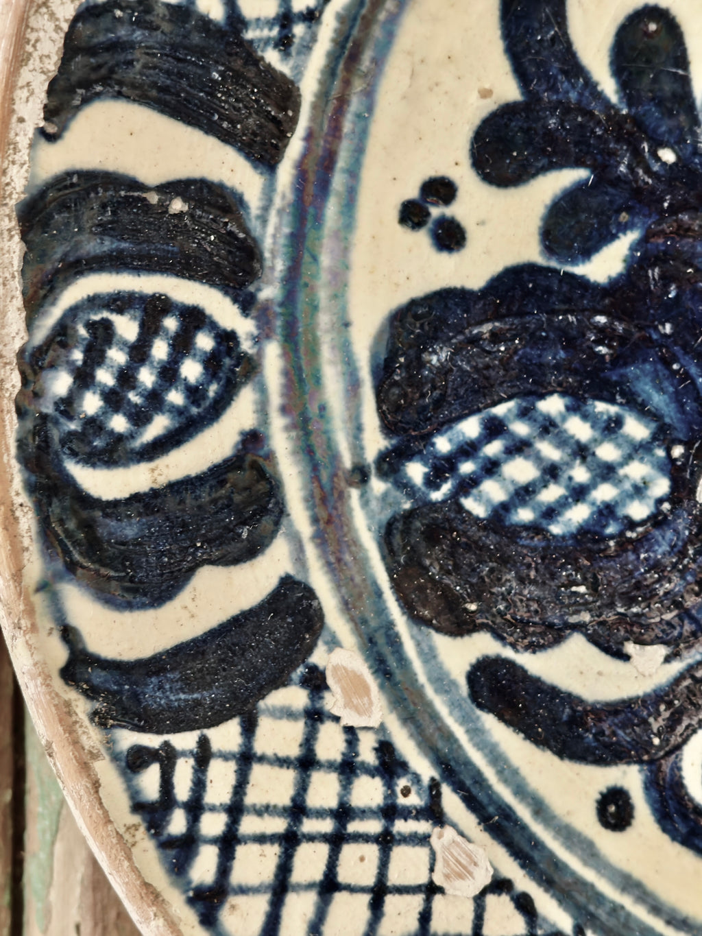 Close-up of a ceramic plate with blue and white decorative patterns