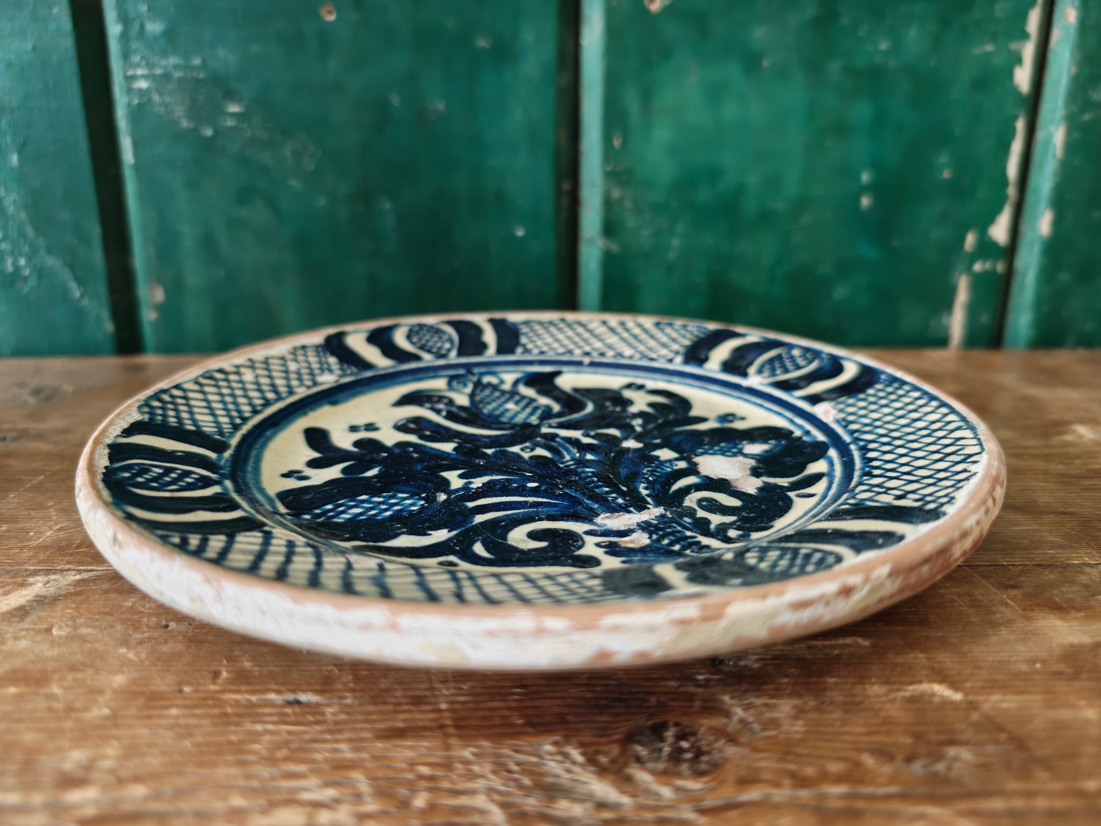 Ceramic plate with blue and white floral design