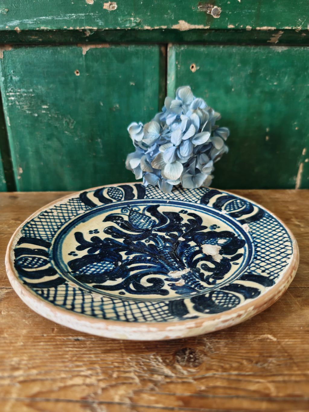 Blue and white decorative plate with intricate patterns 