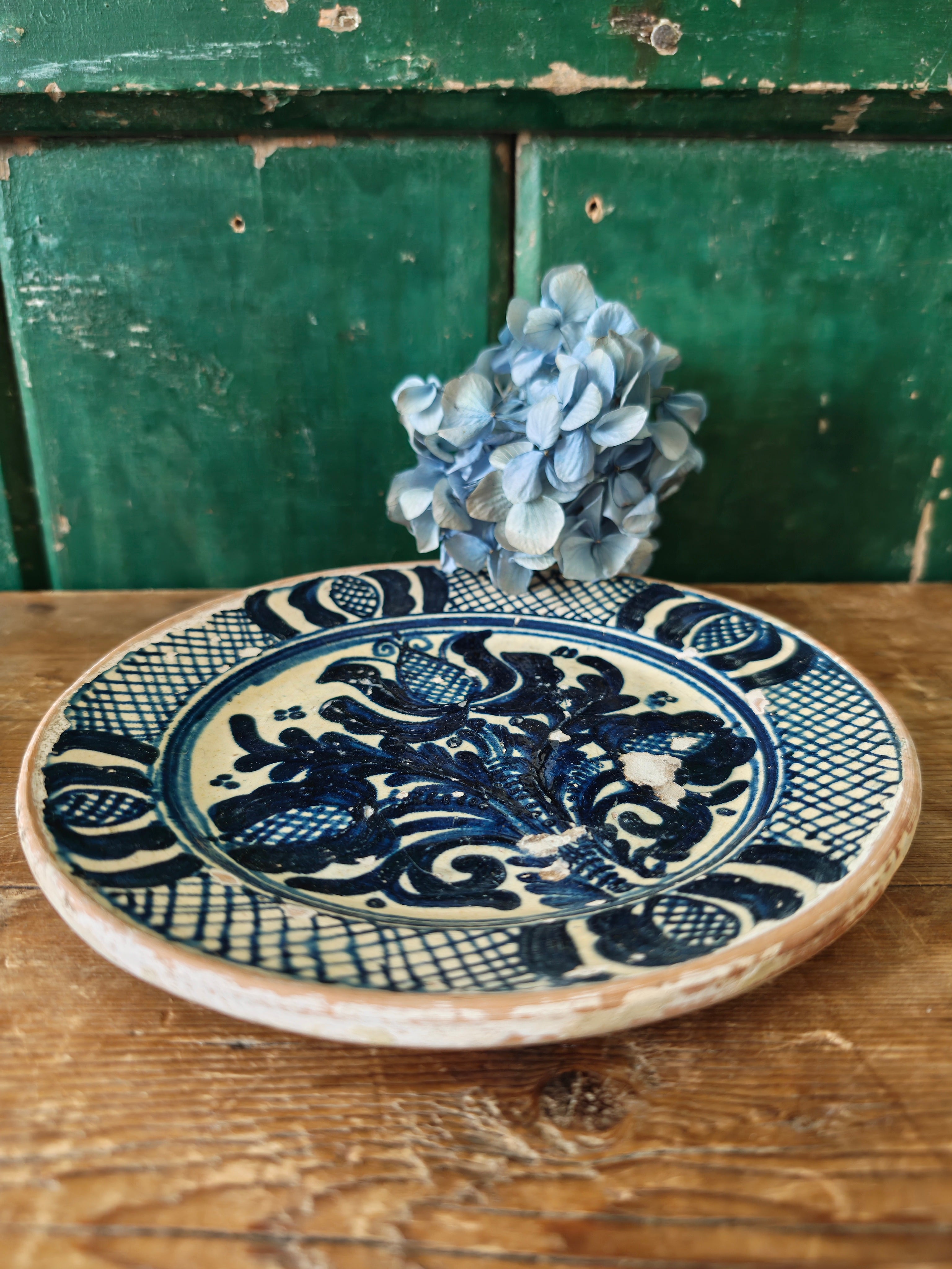 Blue and white decorative plate with intricate patterns 
