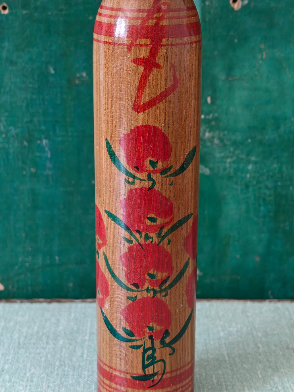 Hand painted floral design on wooden figure