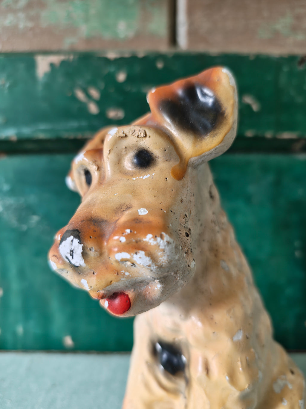 Close-up of a chalk dog figurine