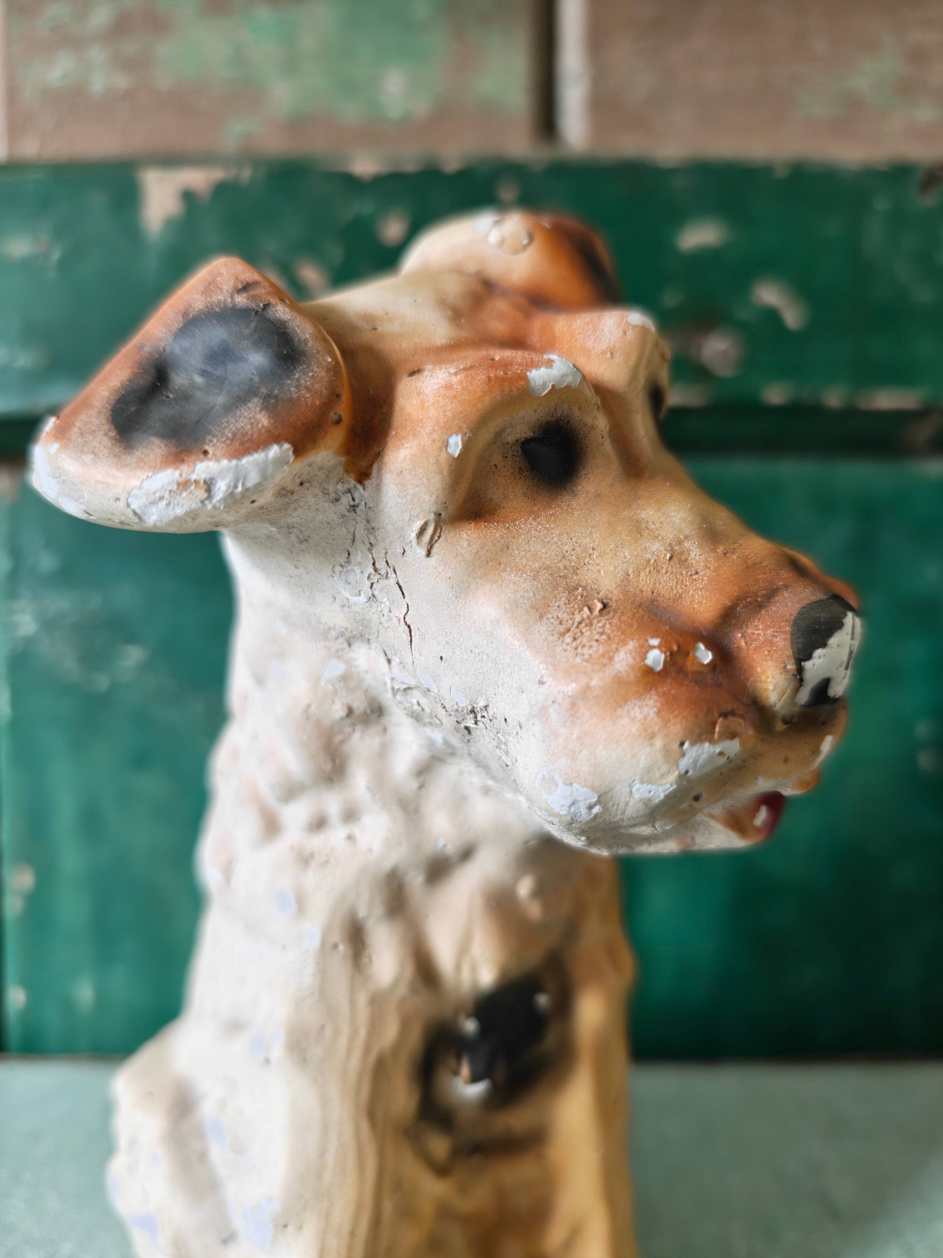Head of a vintage plaster dog figurine