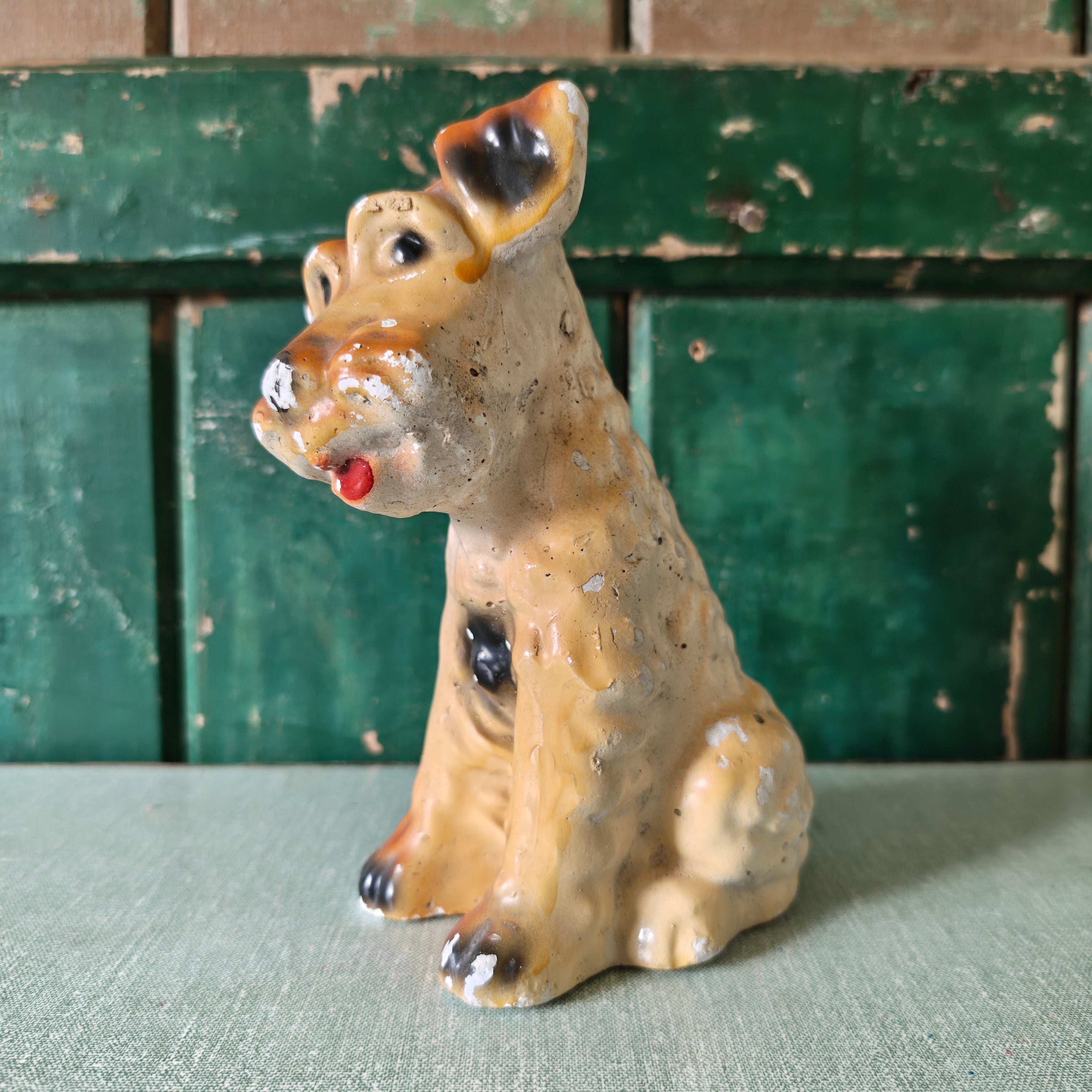 Plaster dog figurine with tan colouring
