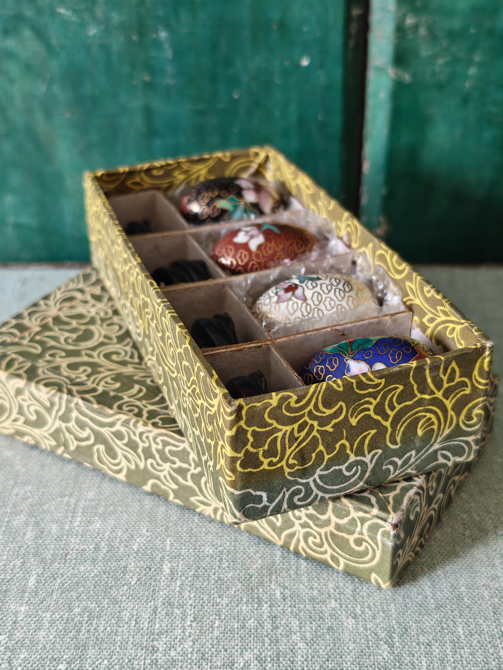 Decorative box containing four decorative eggs