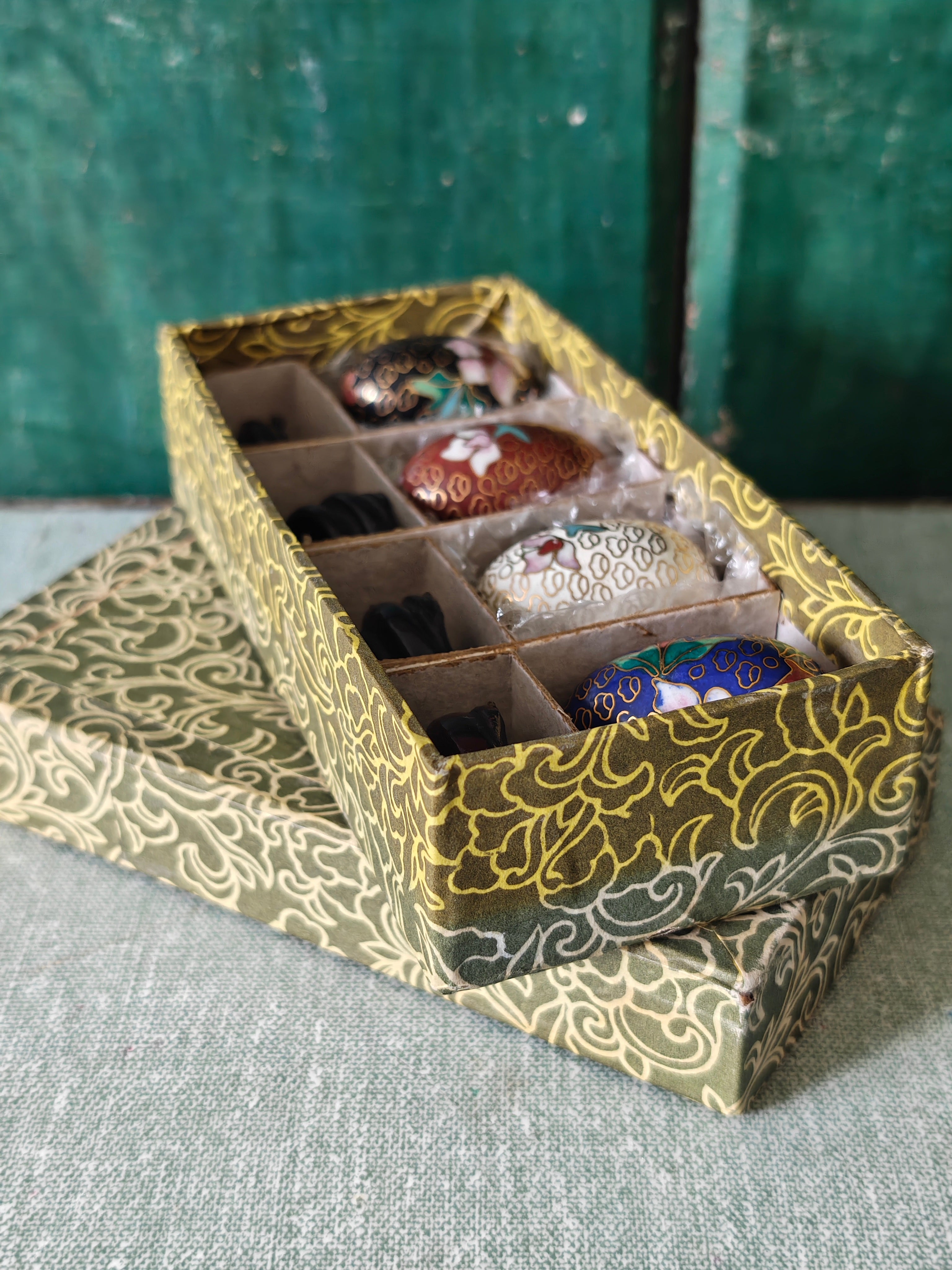 Decorative box containing four decorative eggs