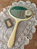 Vintage ivory coloured oval hand mirror
