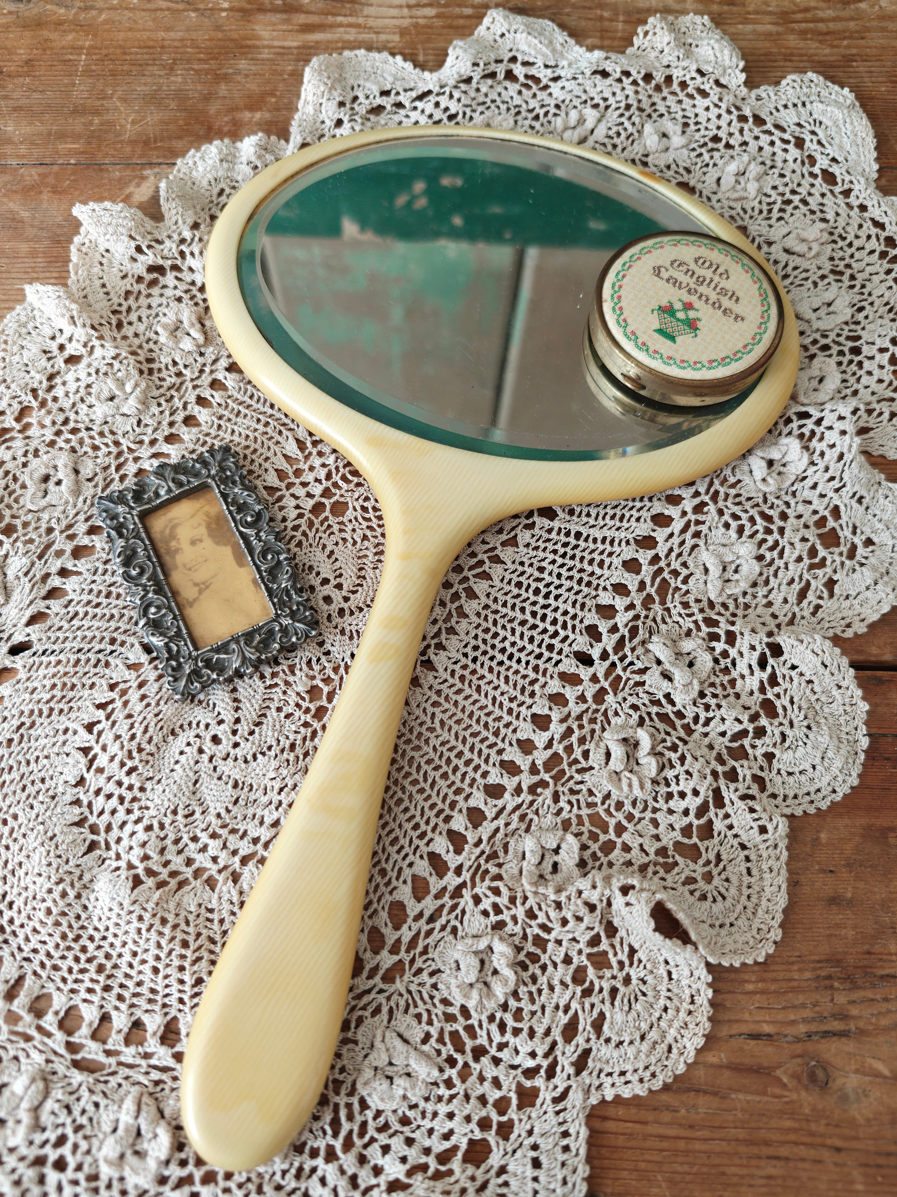 Vintage ivory coloured oval hand mirror