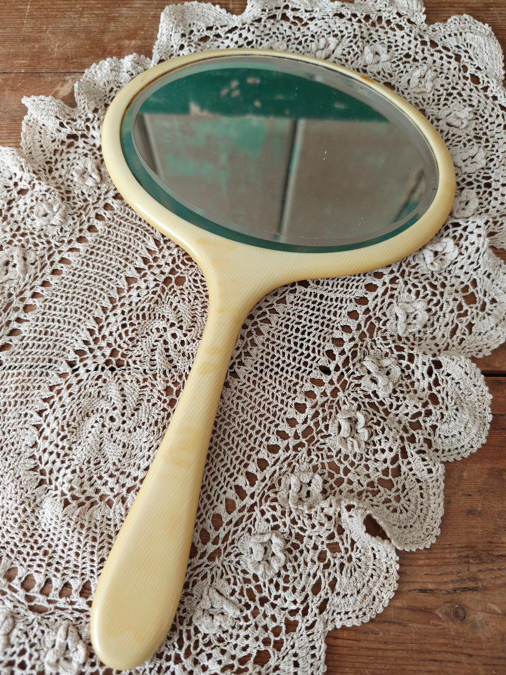 Vintage ivory coloured oval hand mirror