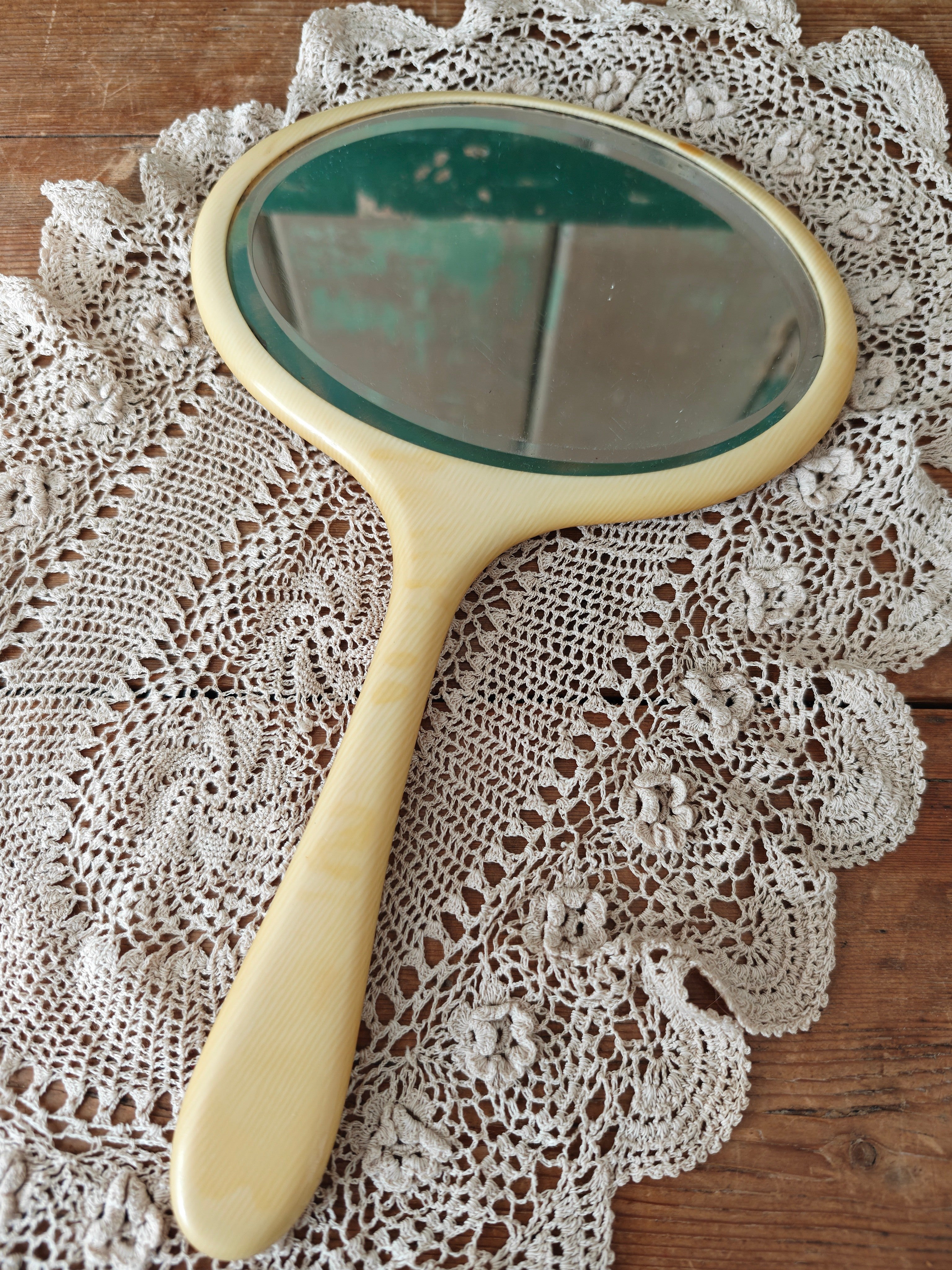 Vintage ivory coloured oval hand mirror