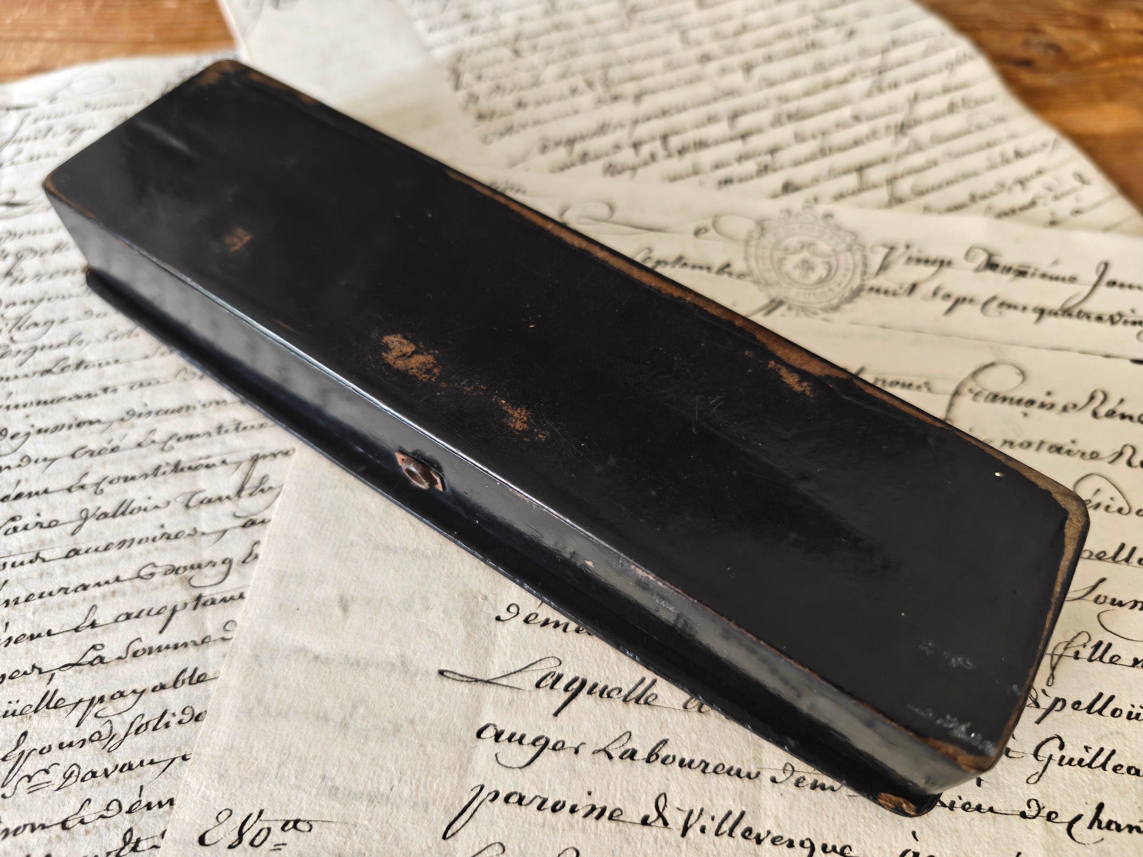 detail of the underside of a black lacquered box