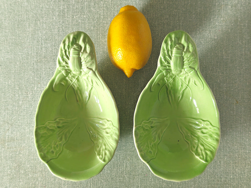two green ceramic dishes with lobster design