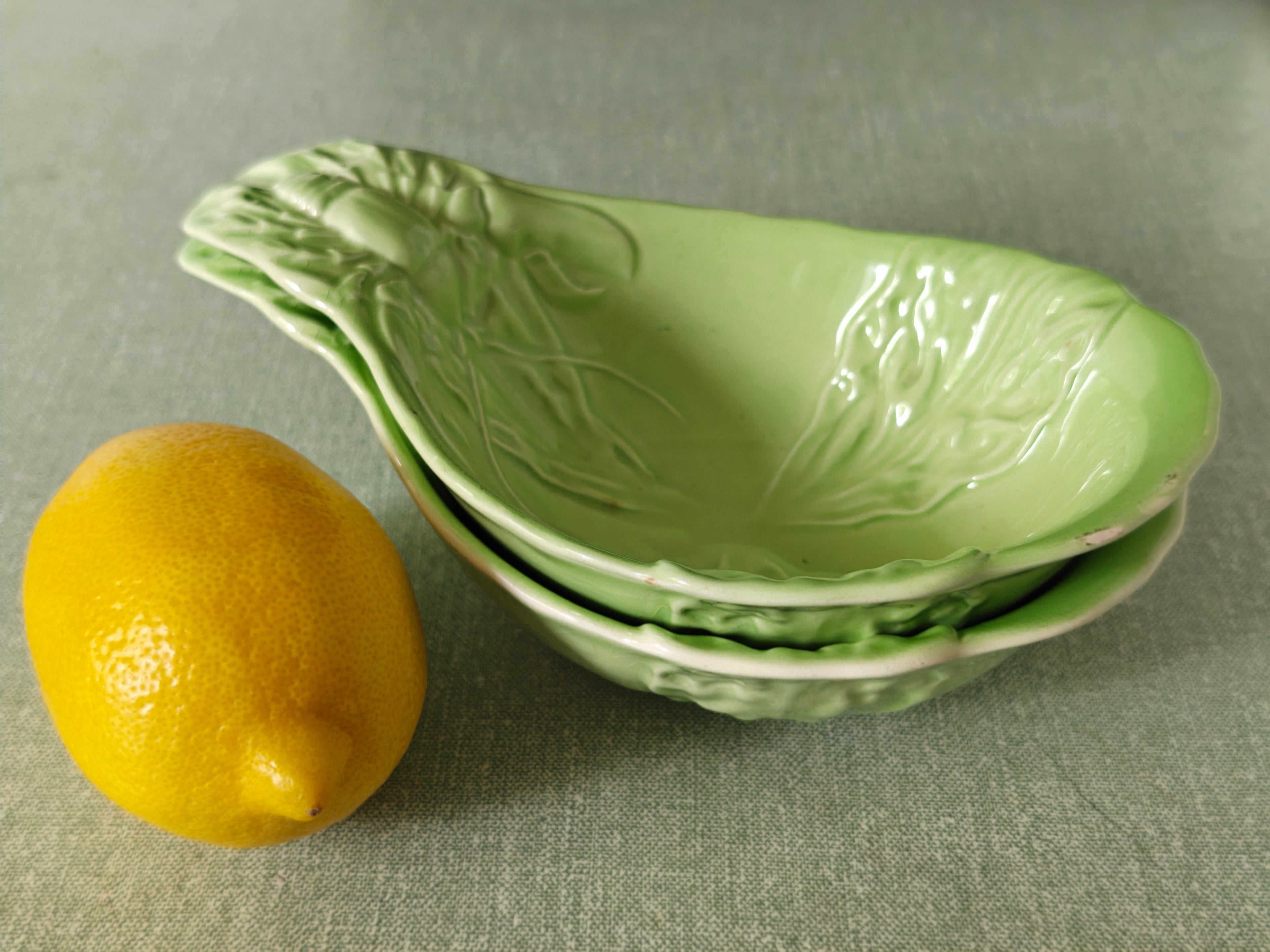 pair of green ceramic stacking 
bowls