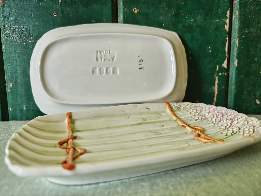 Side view and back view of two ceramic asparagus dishes