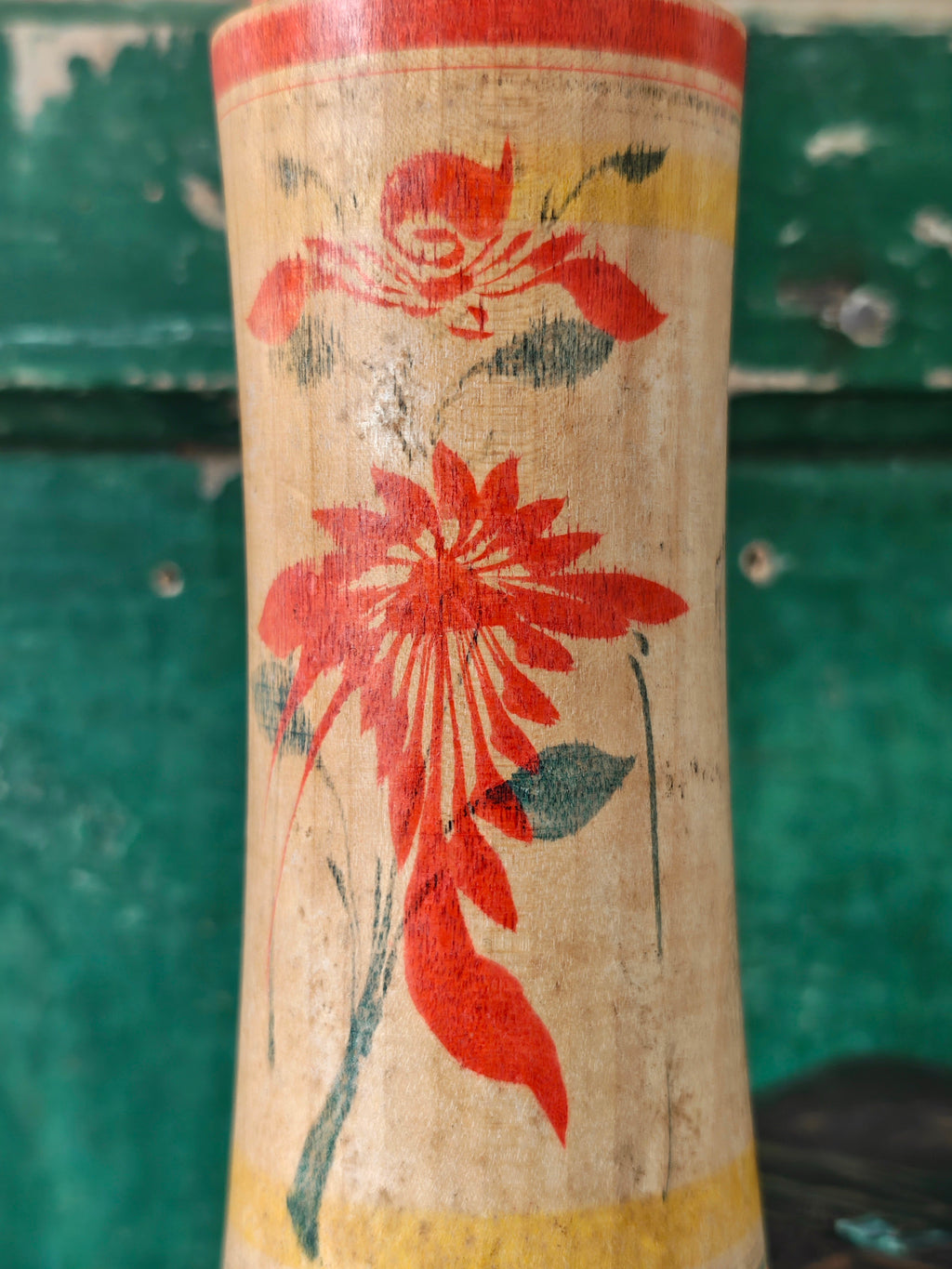 Hand painted decoration of a Kokeshi doll
