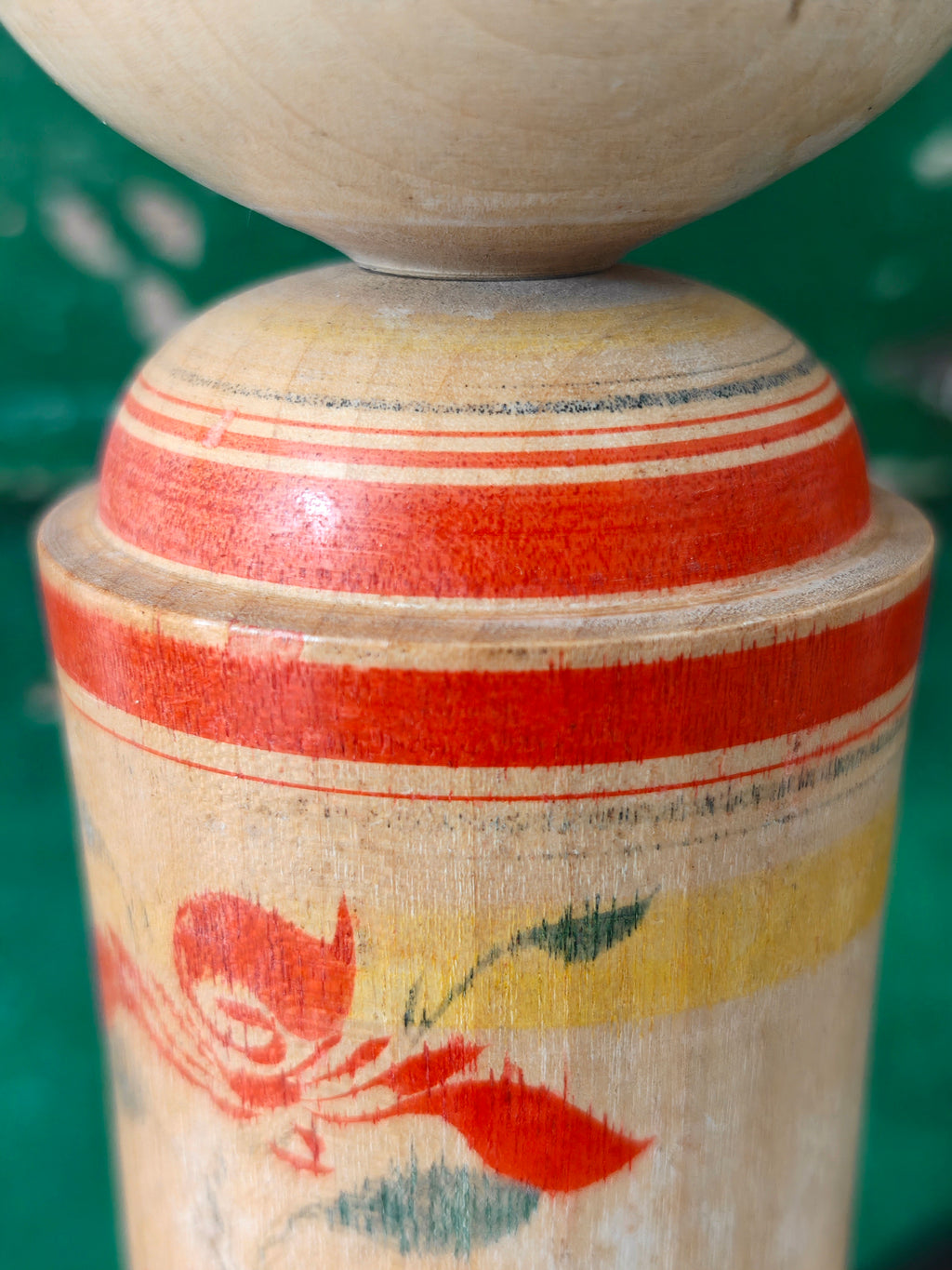 Hand painted decoration of a Kokeshi doll